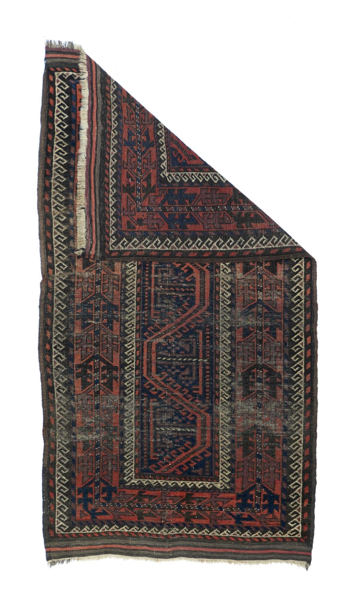 Antique Balouch Rug 2'10'' x 5'7''. The narrow navy field of this East Persian nomadic scatter shows a segment of the hooked 