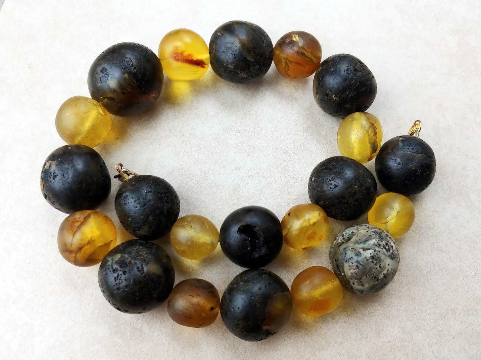A genuine, ancient Baltic amber necklace weighing 229 grams, approx. 1900s. The diameter of the largest bead is approx. 36mm. The diameter of the smallest bead is approx. 21mm. All beads were cut by hand, so they are not ideally round. They are not