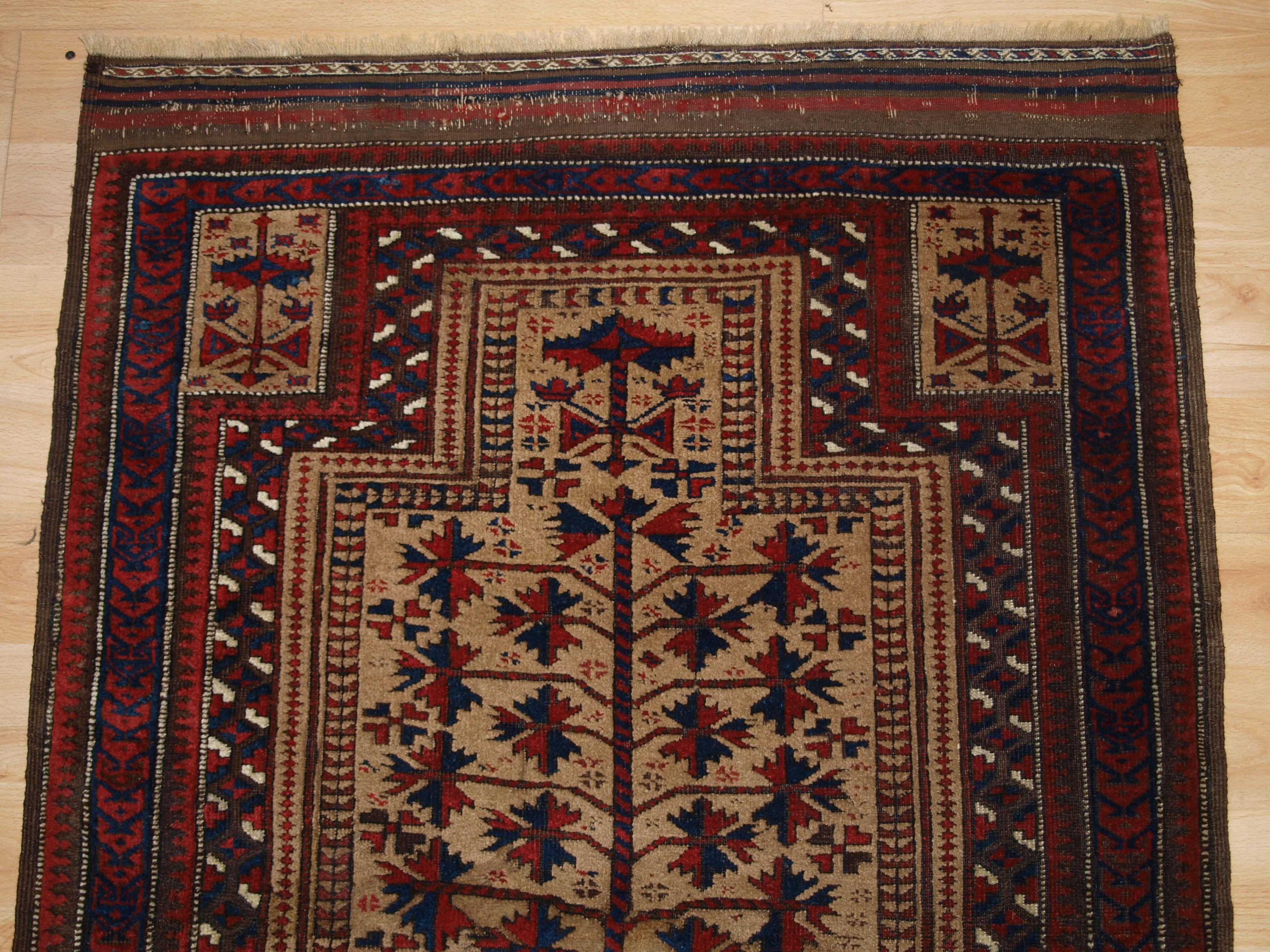 
Size: 3ft 10in x 2ft 10in (117 x 86cm).

Antique Baluch camel ground prayer rug a design that is typical of the Sarakhs Baluch of Khorasan.

Late 19th century.

The rug is beautifully drawn with a tree of life and has excellent colour, the camel