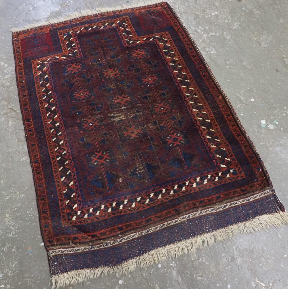 Antique Baluch prayer rug by the Yaqoub Khani sub tribe of the Timuri, with box design on a scarce aubergine coloured ground
Circa 1880 or earlier

This is a very unusual and possibly rare Timuri / Baluch prayer rug, the well known box design is on