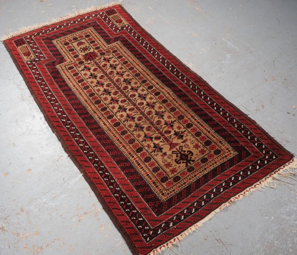 Antique Baluch camel ground prayer rug a design that is typical of the Sarakhs Baluch of Khorasan
Circa 1880

The rug is beautifully drawn with a tree of life and has excellent colour, the camel wool ground is very soft Of particular note is the