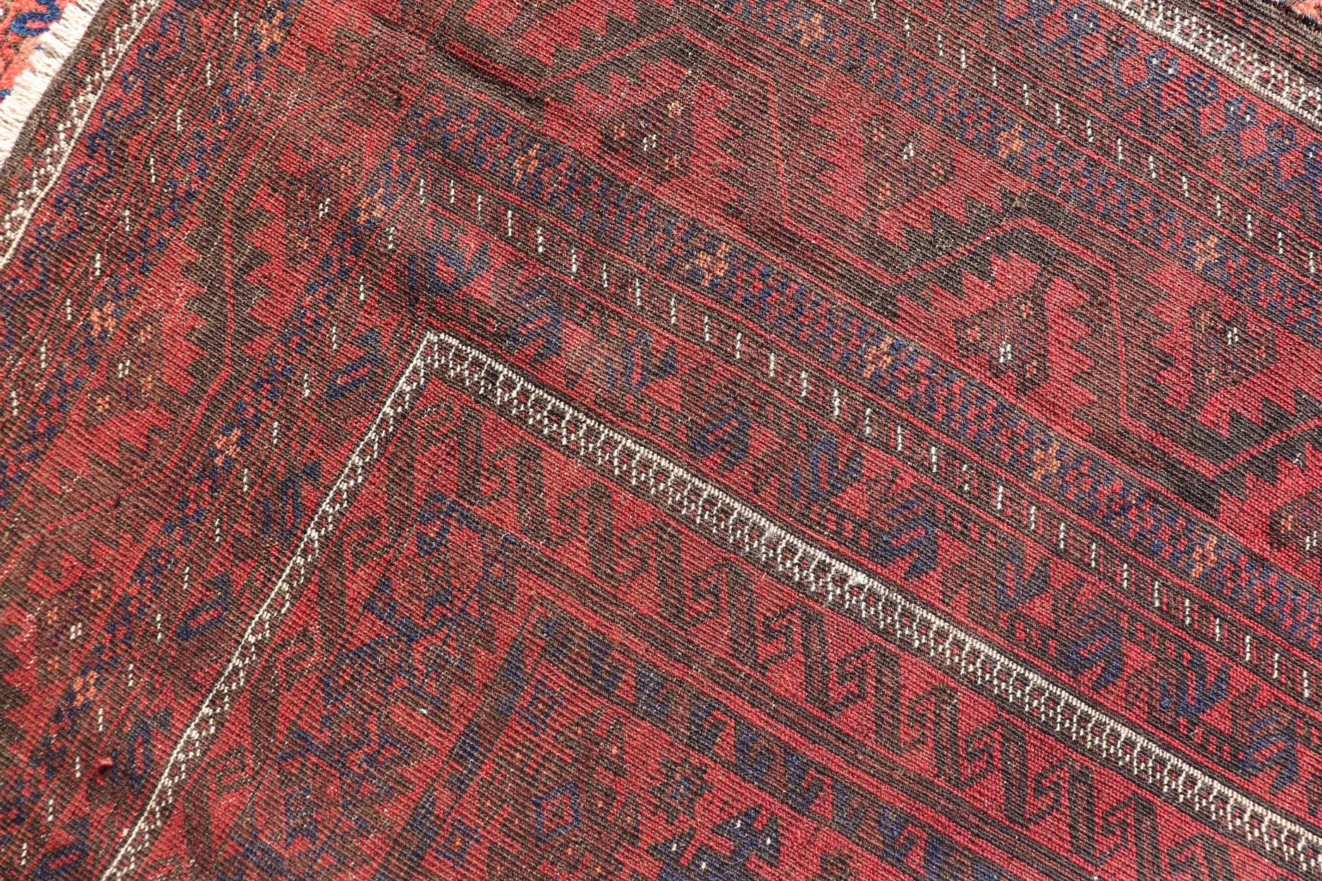 Wool Antique Baluch Tribal Rug with All-Over Geometric Diamond Design in Red For Sale