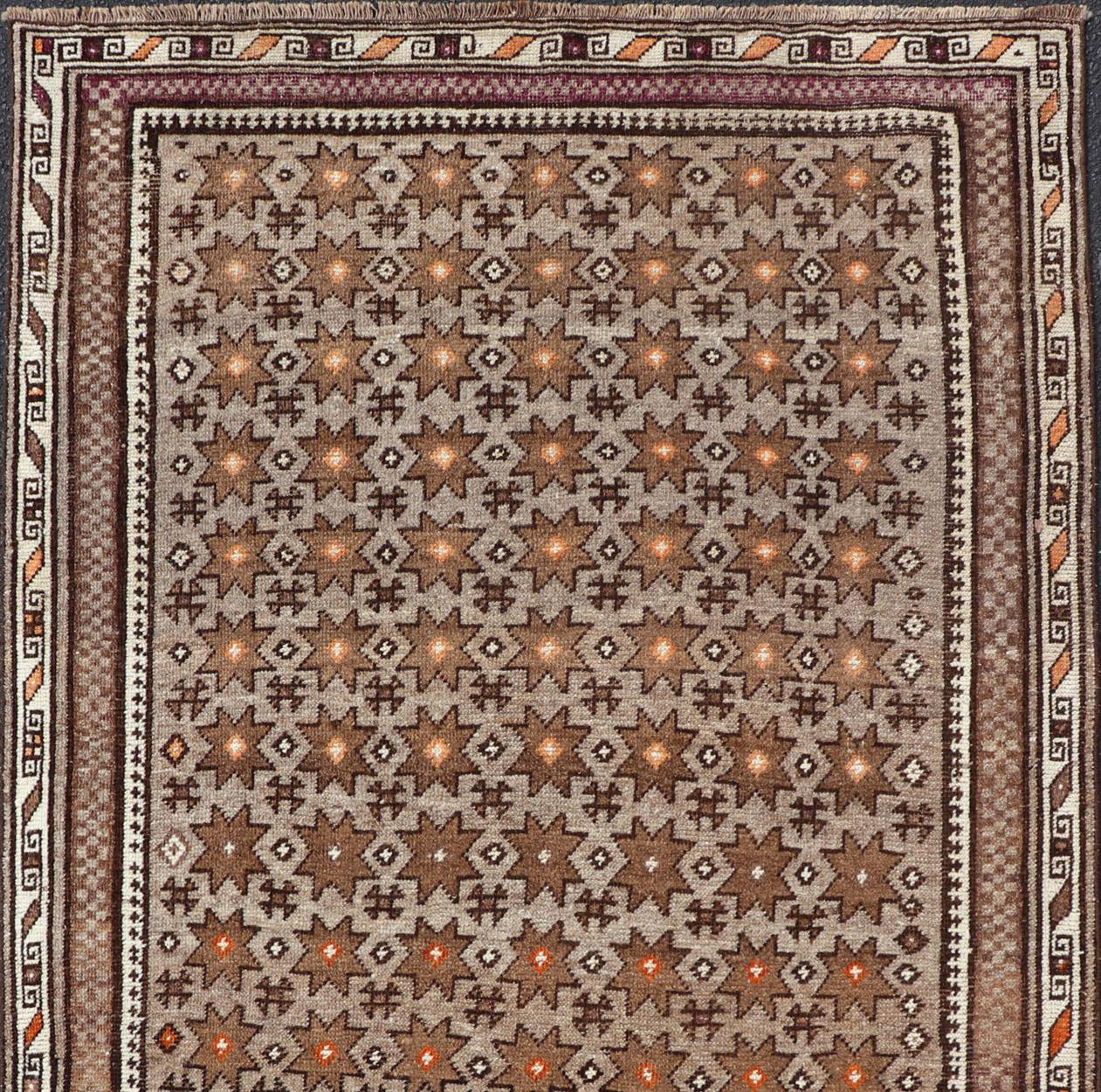Antique Baluch Tribal Rug with All-Over Geometric Diamond Design on A Gray Ground. Keivan Woven Arts, rug EMB-9677-P13563; country of origin / type: Iran / Baluch, circa 1930s.

This Antique Baluch Rug has been hand-knotted and features an