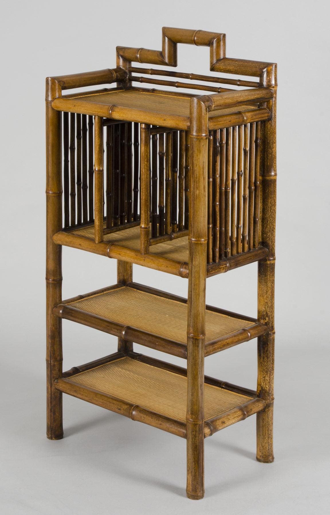 Antique bamboo bookcase with three vertical sections above two horizontal shelves with woven bamboo matting.