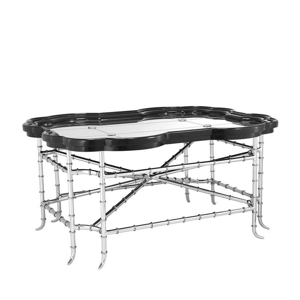Coffee table antique bamboo with structure in polished
stainless steel with mirror glass top in antique finish.
Frame top in black lacquered finish.