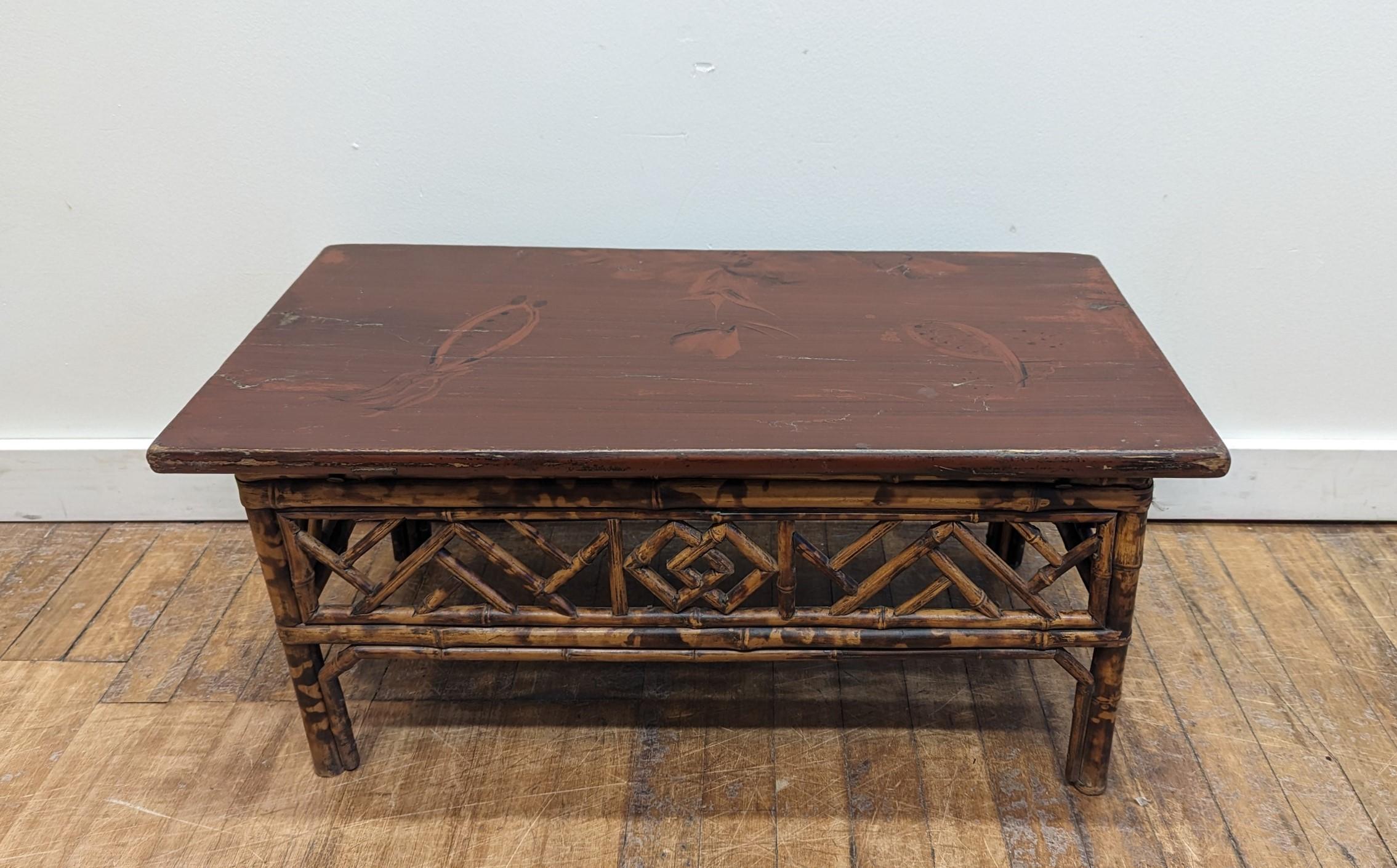 Bamboo Kang Table of the Qing Dynasty period.  Speckled Bamboo low Kang Table wonderfully constructed with fretted apron stretchers and struts.  A double happiness symbol is centered on the aprons of both sides with an abstract floral image in the