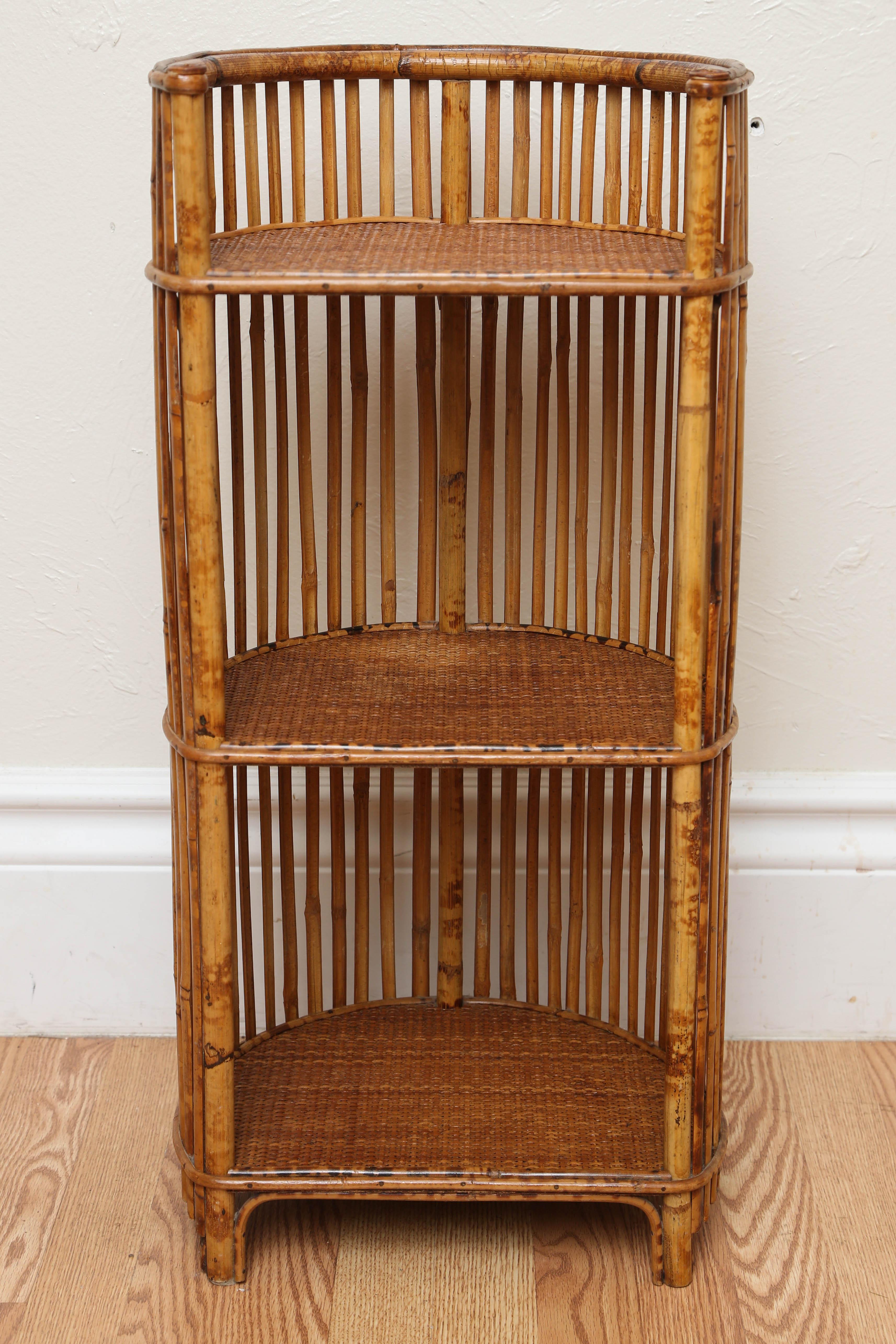 Antique bamboo and raffia three-tier shelf.