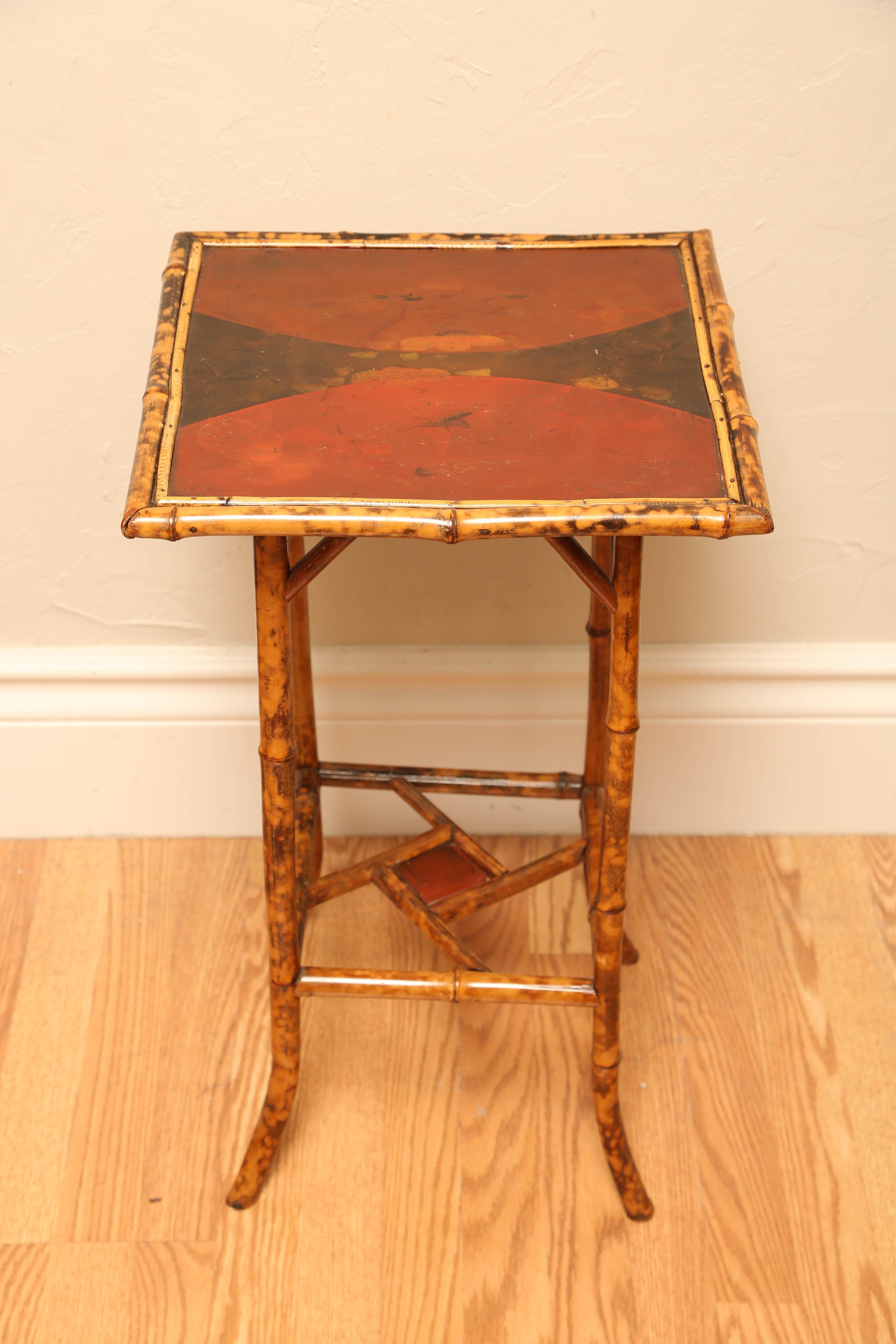 Antique bamboo end table with Japanned top.
