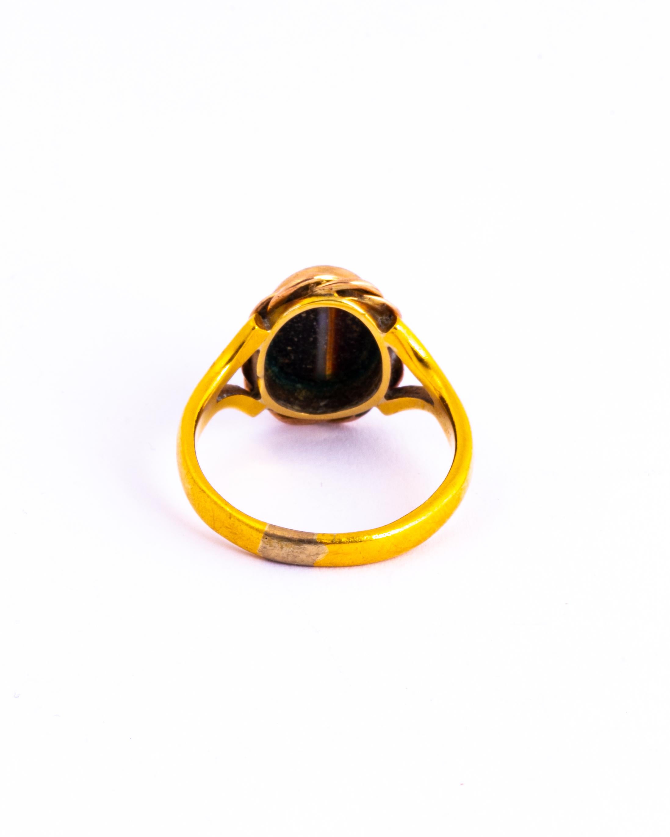 This banded Agate is so glossy and beautiful! This stone is set in 9 carat gold with rope twist detail which goes perfectly with the Agate.

Ring Size: O 1/2 or 7 1/2
Stone Dimensions: 10.5x8mm

Weight: 5.3g