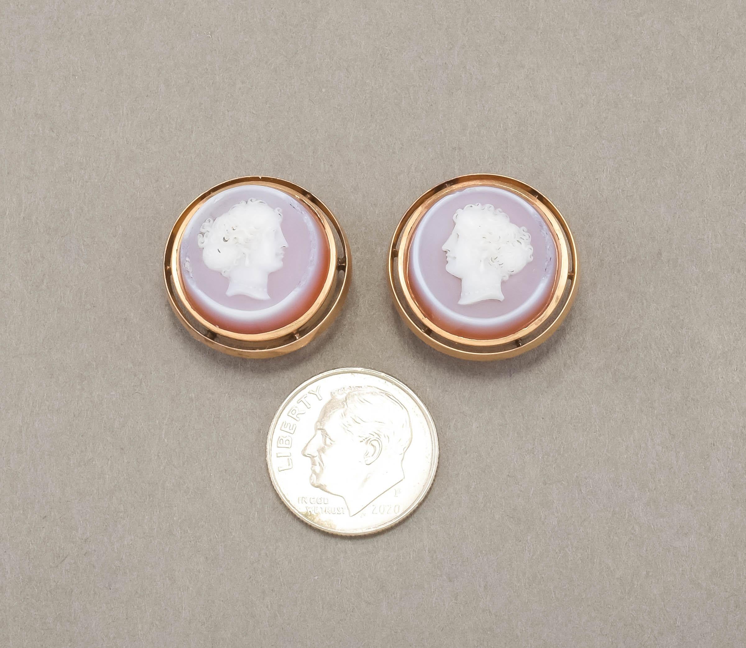 Offered is an elegant pair of Victorian hand carved cameo cufflinks or buttons, estimated to date to 1870 or so.  Set in rosy yellow 14K gold, each backing has a hand engraved monogram of 