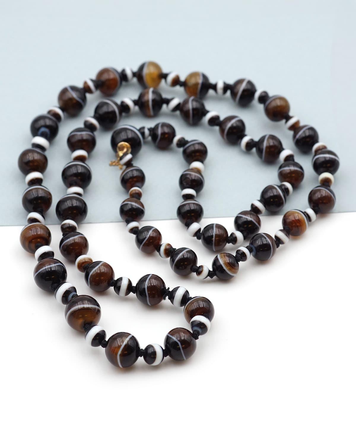 Bead Antique banded agate necklace with its 14 karat gold clasp, ribboned agate beads For Sale