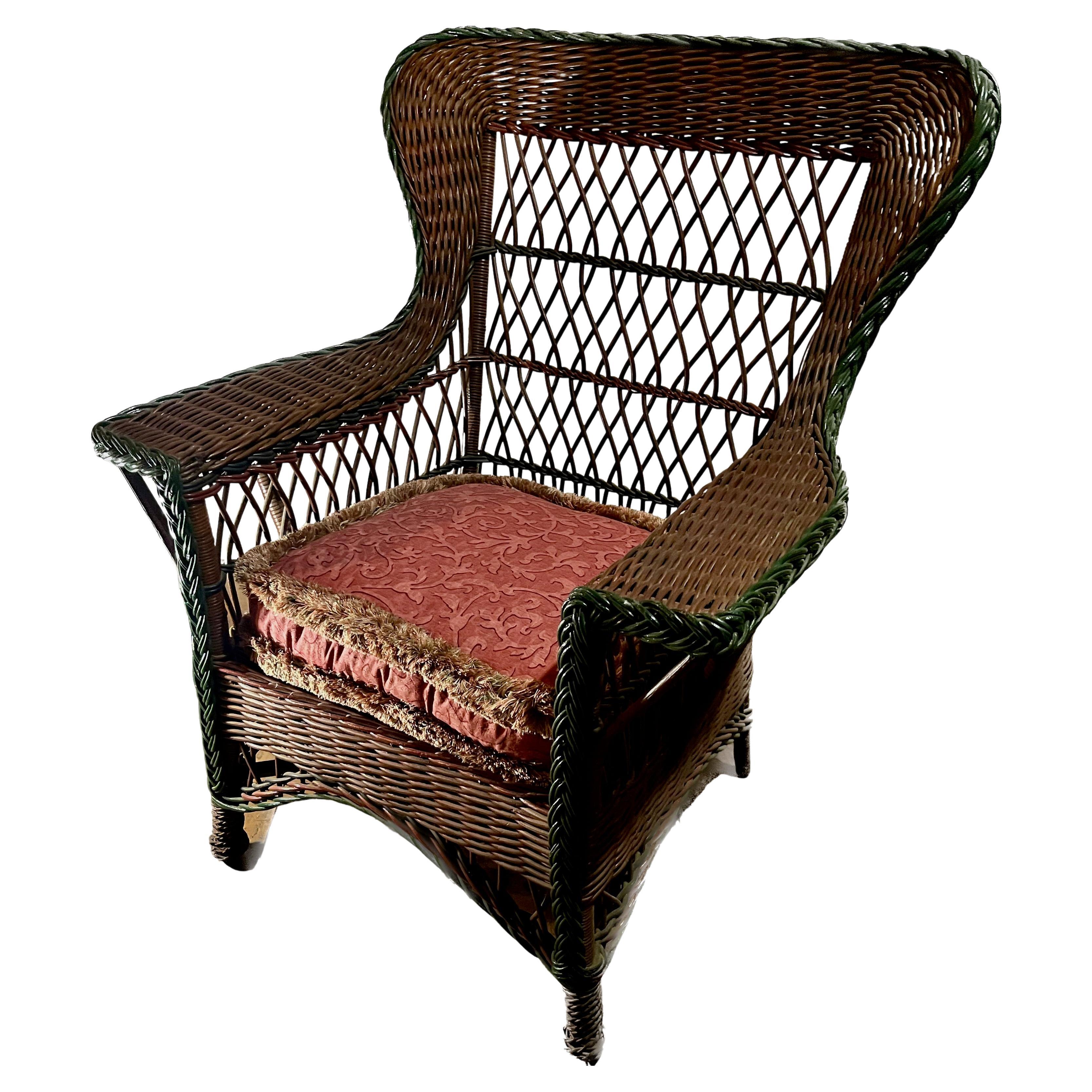 Antique Bar Harbor Style Wicker Wing Chair in Natural Finish with Green Trim For Sale