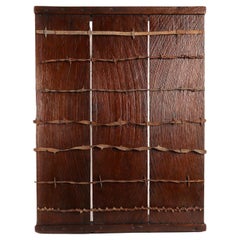 Antique barbed wire collection on wooden board, from USA, end of 19th century.