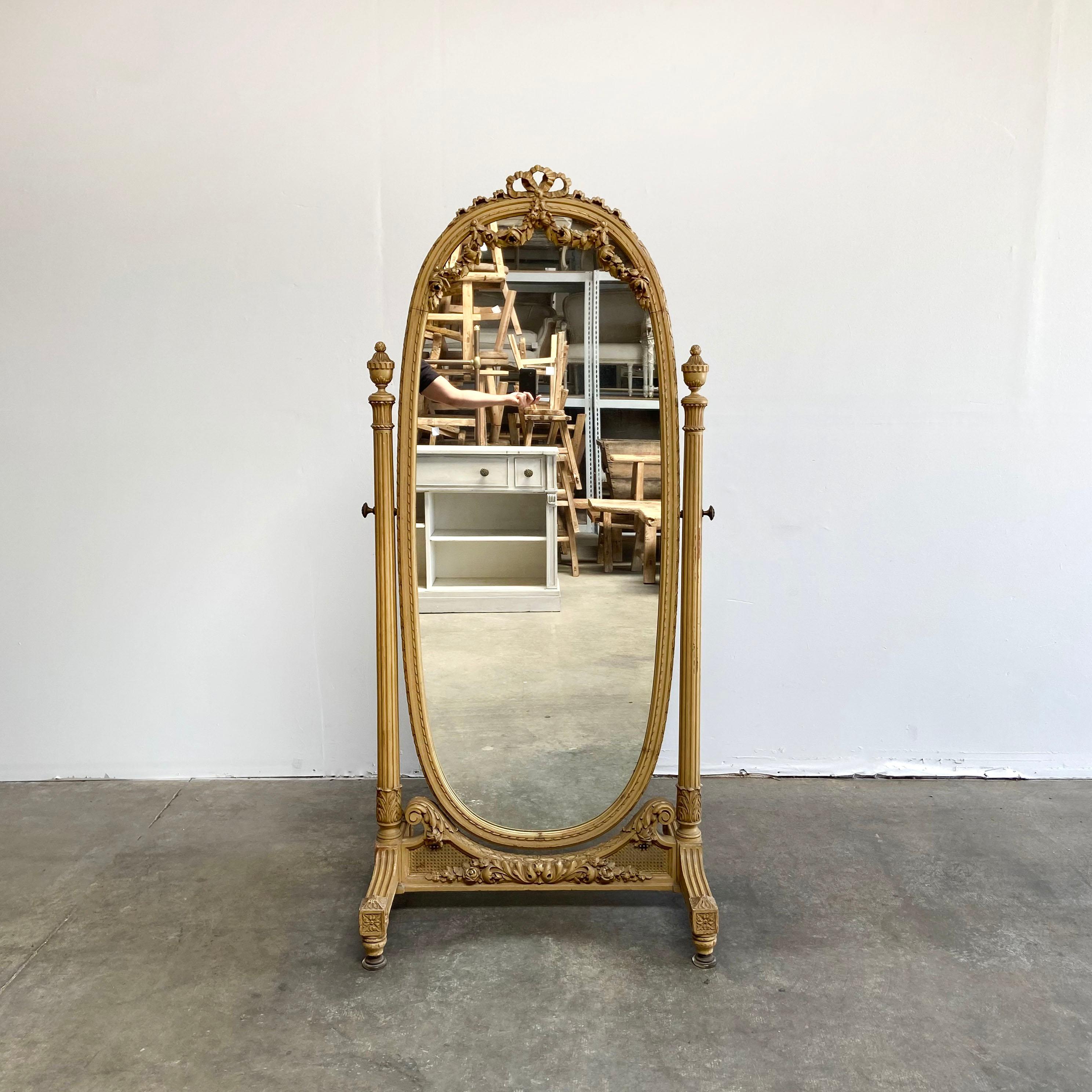 Antique Barbola roses swag carved Cheval mirror original finish.
Original finish, in a dark cream color. Beautiful carved detailed roses swag down over the mirror, with ribbon carvings. Adjustable mirror can swivel and tilt front to back. Can be