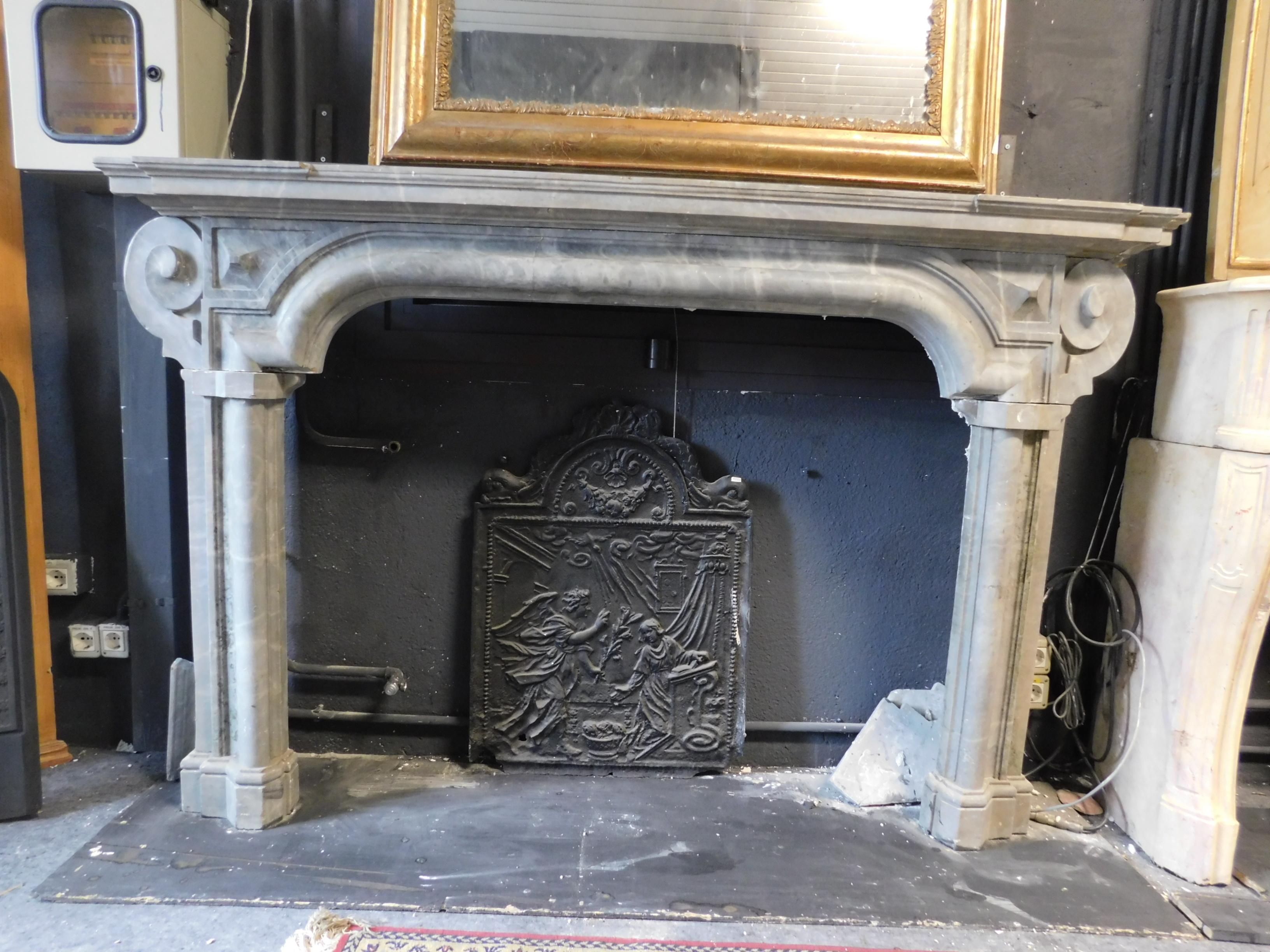 Ancient bardiglio gray marble fireplace, hand carved with ears on the sides and straight legs, 3 unique blocks of carved marble, therefore a lot of valuable marble used. Original from the early 18th century, produced by lineage in northern Italy.