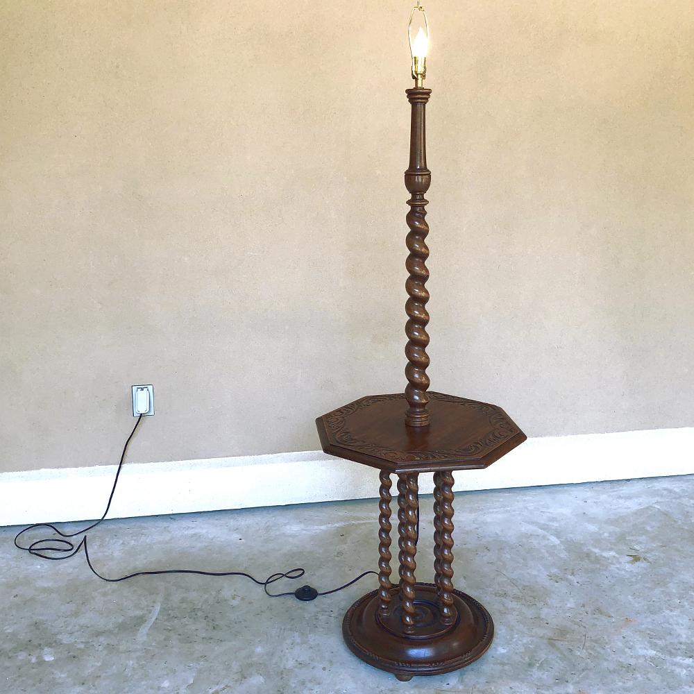 Antique Barley twist floor lamp features an octagonal table surface making it the perfect choice for any seating group! The tabletop surface is carved with a lovely foliate motif, and is supported by no less than five barley twist columns which join