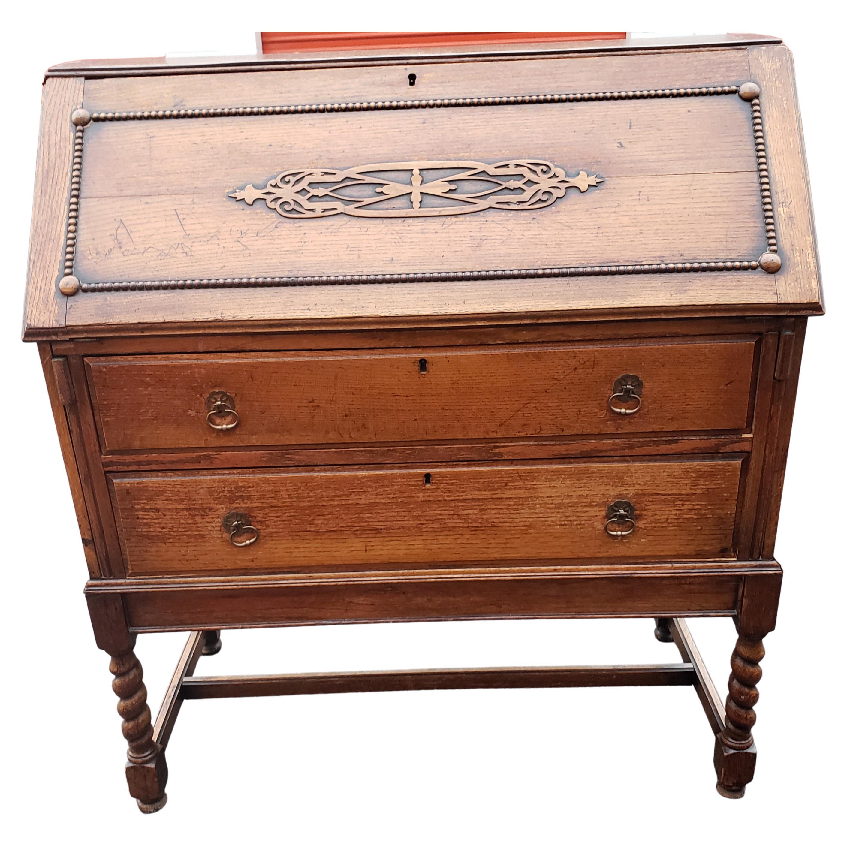 Antique barley twist jacobean desk secretary drop front oak bureau. 
You will love this handsome oak desk with the barley twist details. This piece says character and Old World Charm. It is in great condition and is ready to place in your home. It