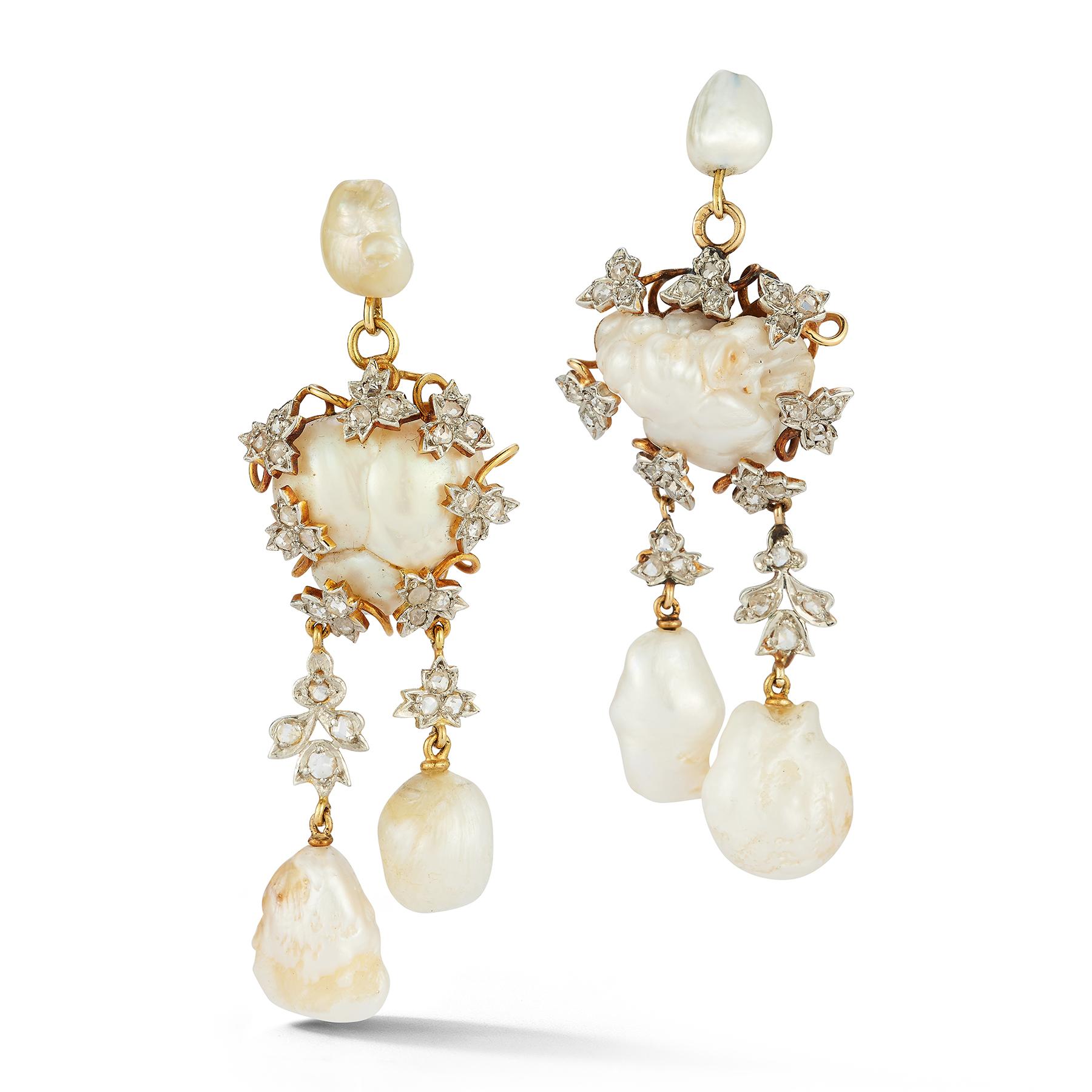 Antique Baroque Pearl And Diamond Earrings

A pair of two tone gold earrings set with 56 round cut diamonds and 8 pearls

Length: 2.38