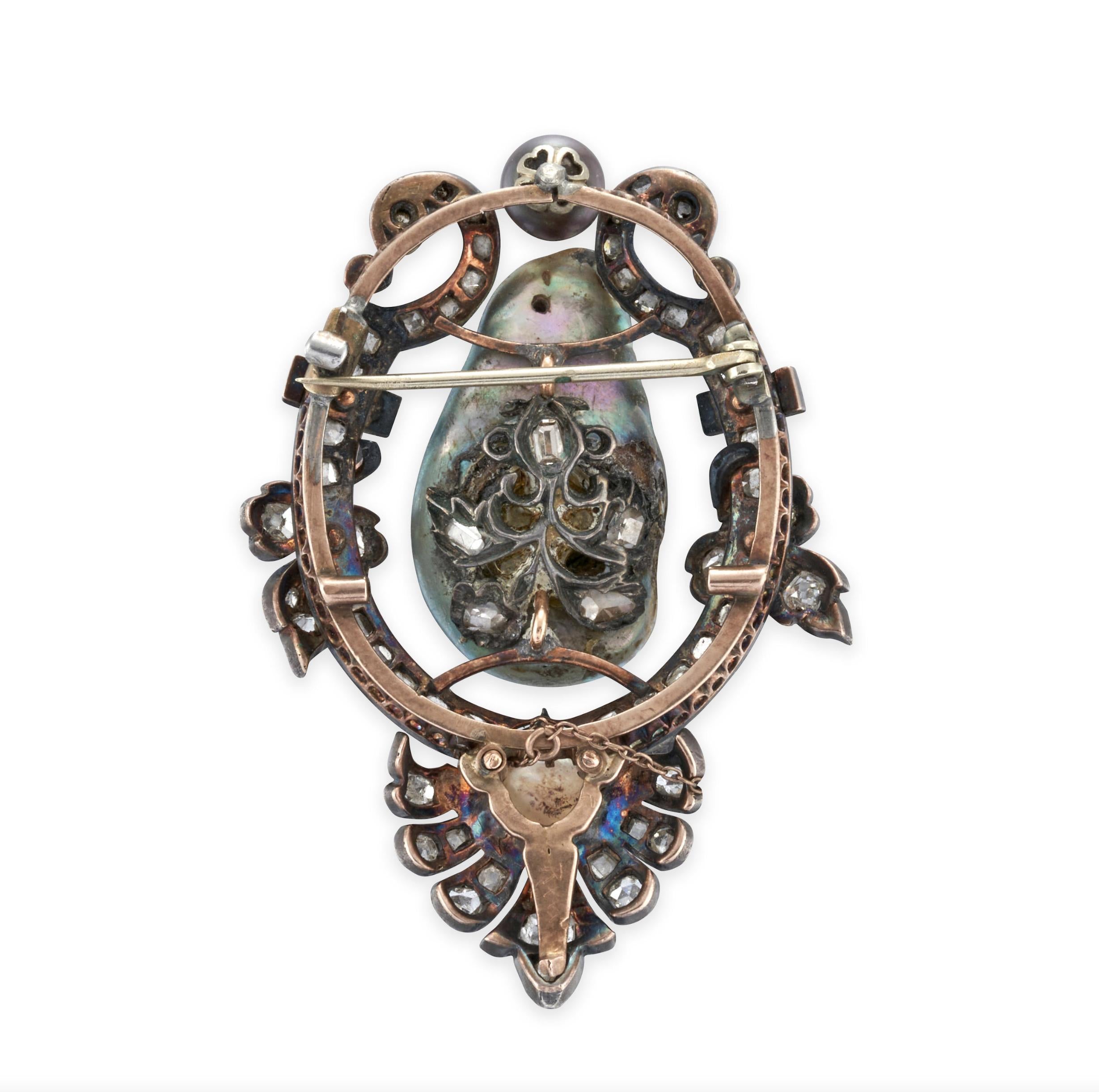 Antique Baroque Pearl, Pearl, and Diamond Brooch

Details:
Centering a large baroque pearl measuring approximately 26.50 x 15.90 x 8.75 mm, within a shaped, foliate motif border, set with rose, old mine, old single, and table-cut diamonds, and set