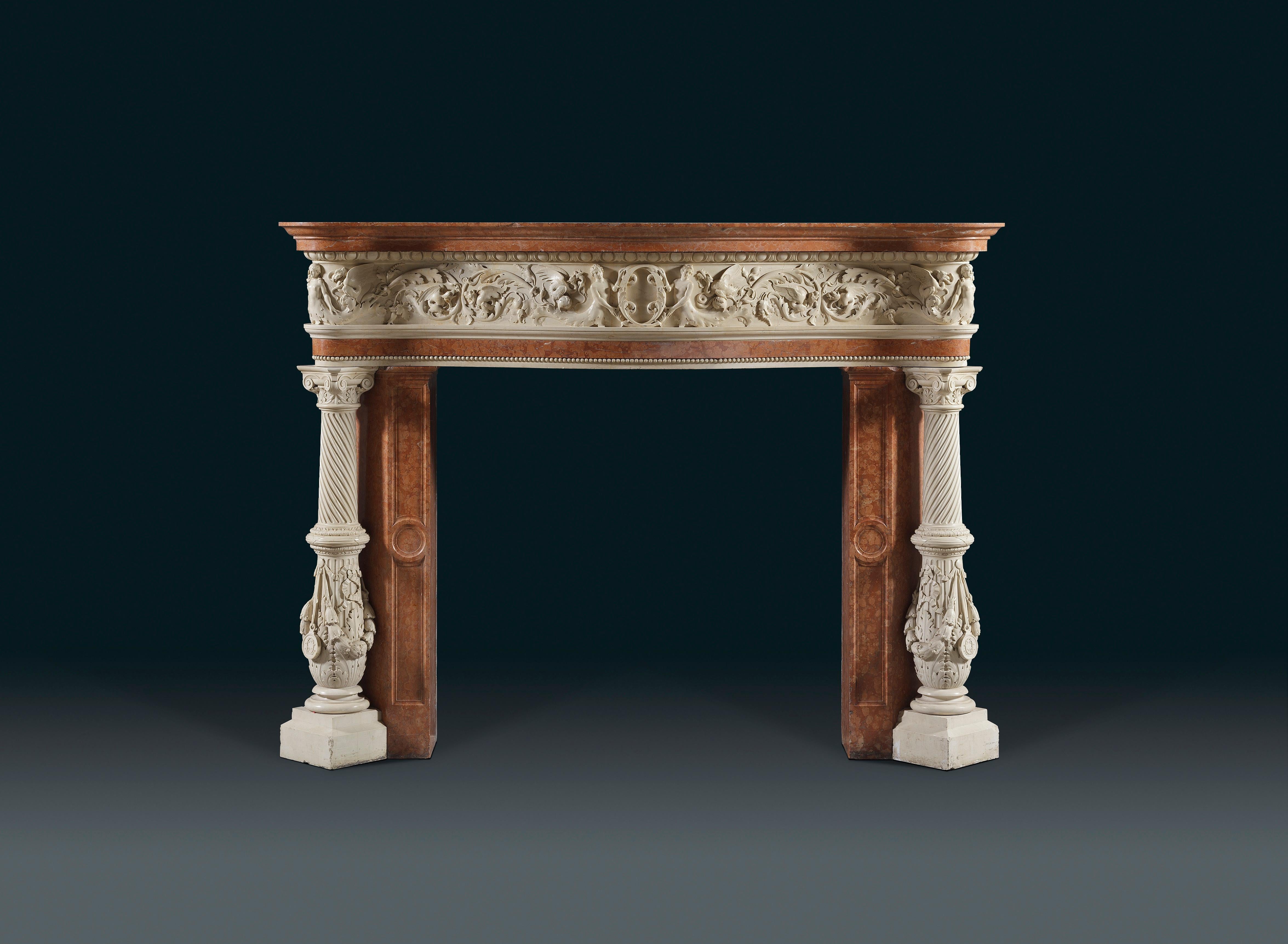 An Italian, Venetian, Renaissance style chimney piece in statuary and Rosso Verona marbles. With serpentine shelf above the statuary curved frieze carved with a central cartouche upheld by two mermaids flanked by fabulous dragons and scrolling