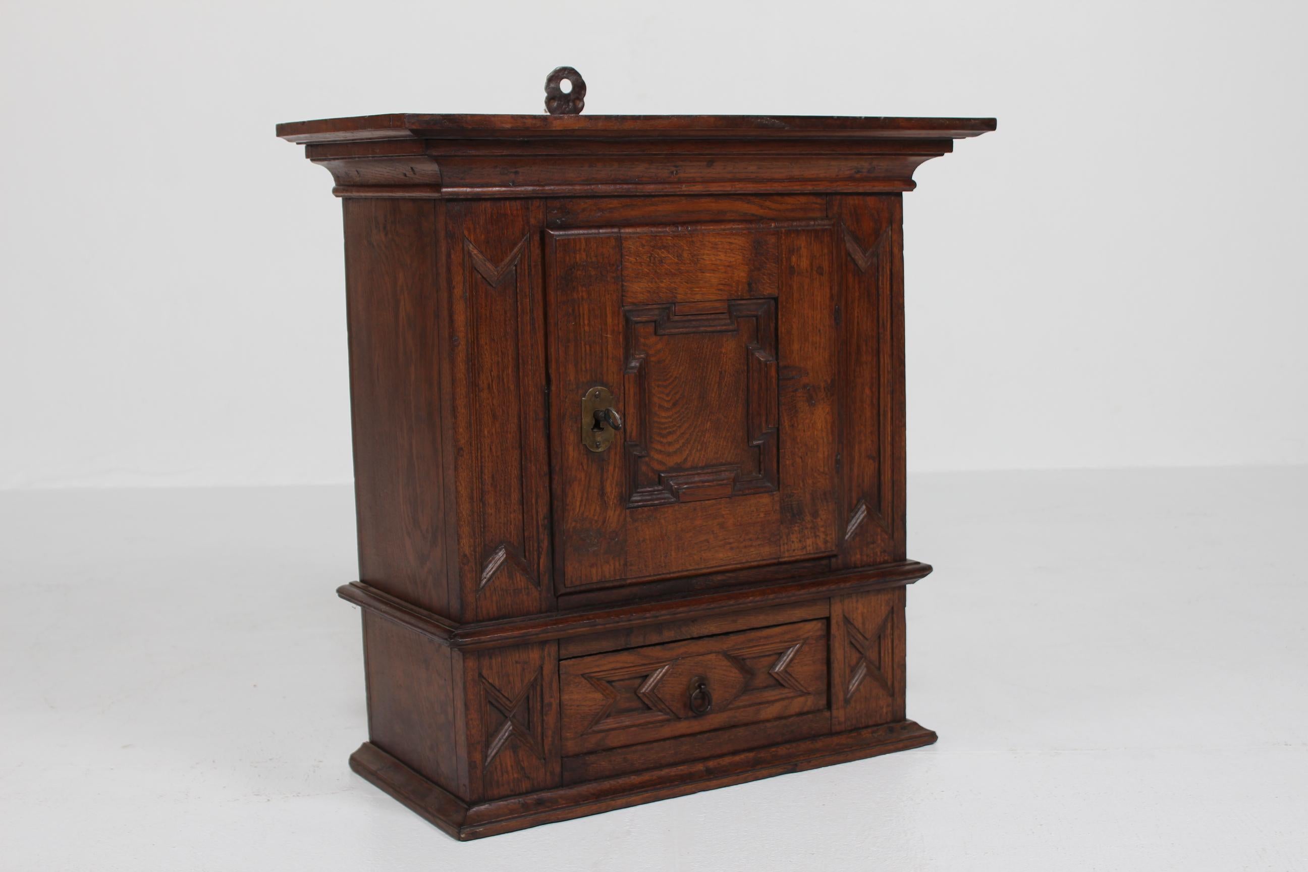 Antique Baroque Style Hanging Cabinet of Dark Oak with Wood Carvings ca. 1800 For Sale 1