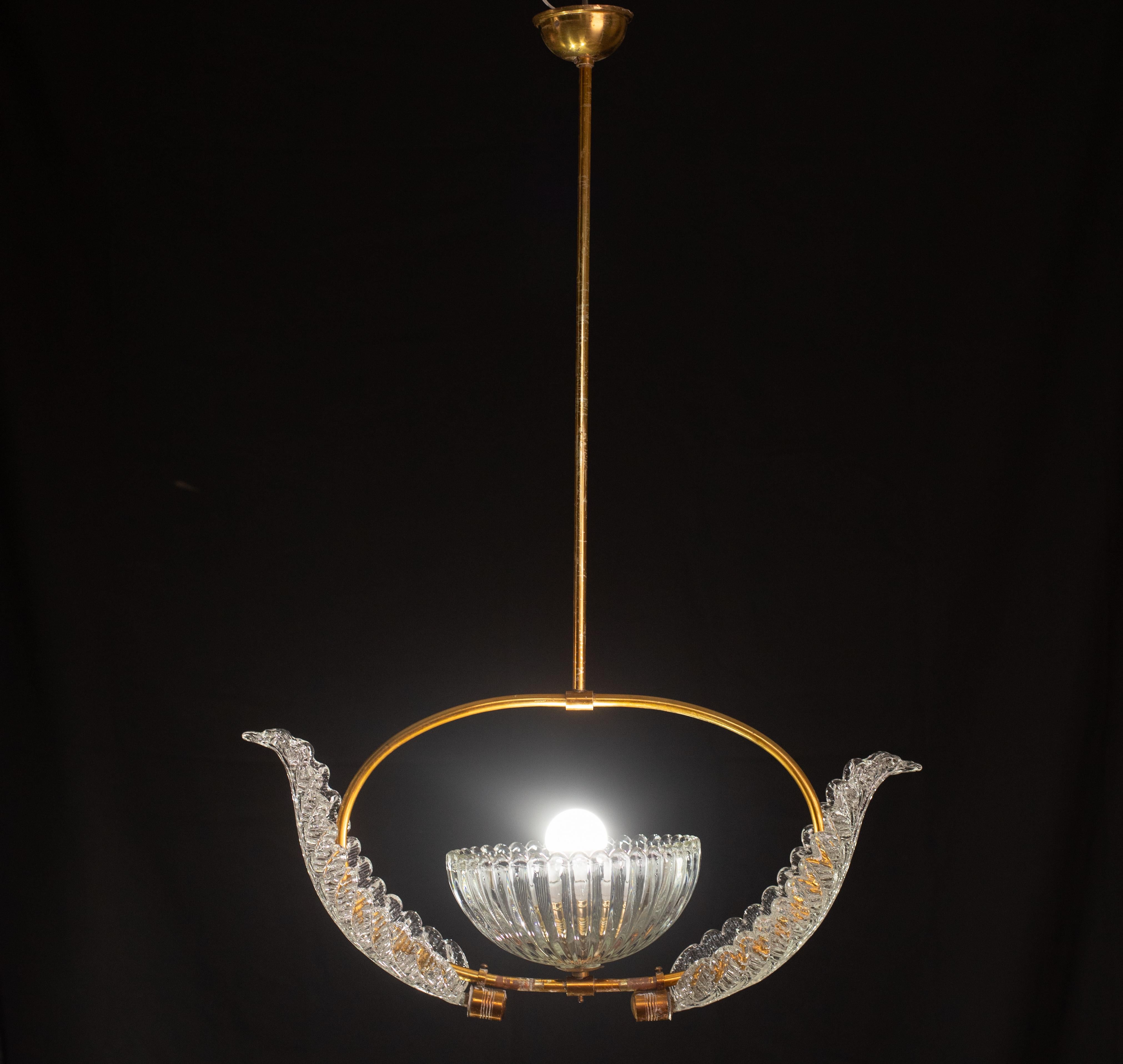 Pretty Murano chandelier attributed to Ercole Barovier.

The chandelier measures 75 centimeters in height, 30 centimeter with no rod, and 50 cm diameter.

Good vintage, some sign of the time on the structure, perfect glass.

Possible to switch for