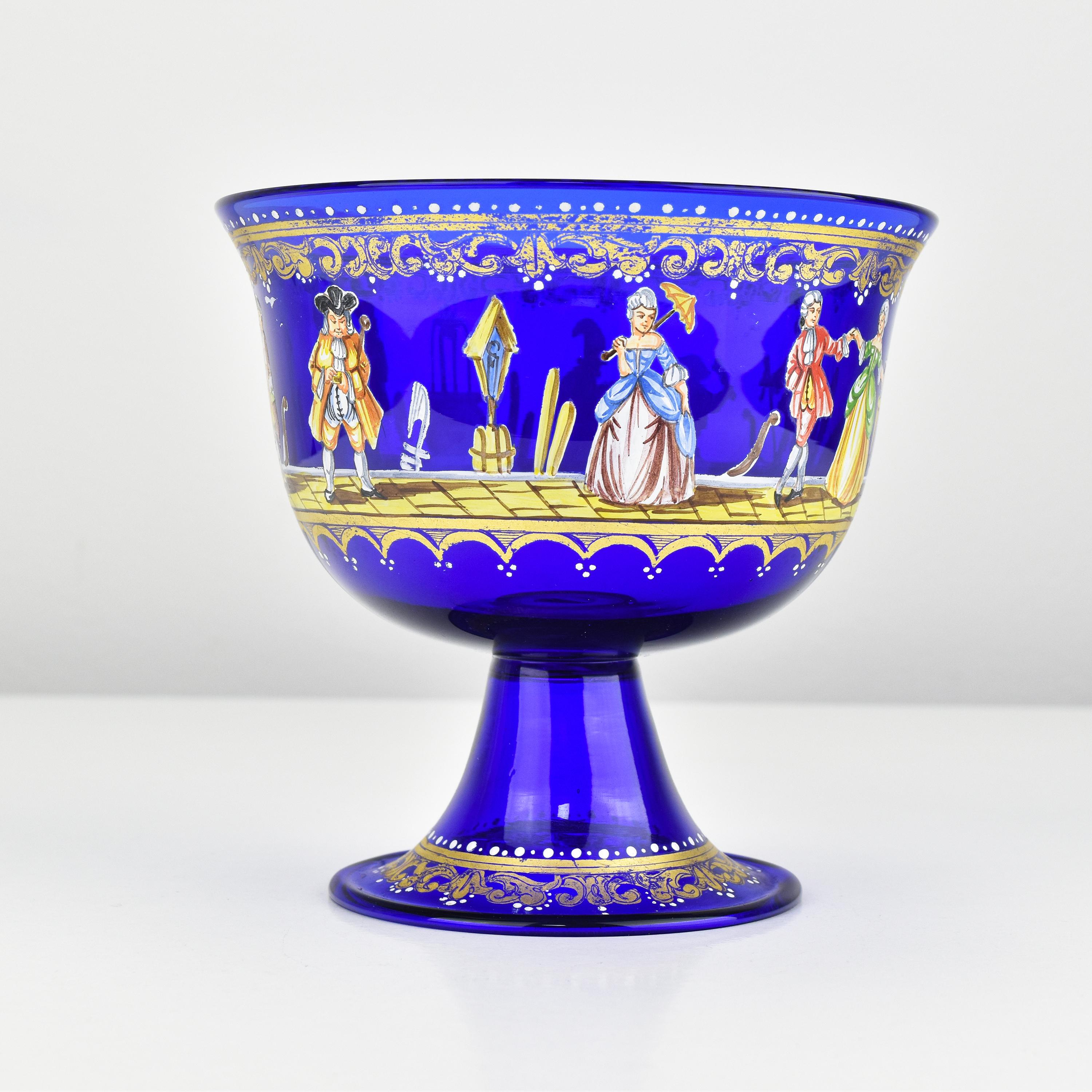 Antique or Vintage Wedding Cup - Rare Murano Glass in Royal Blue

This wedding cup Grand Tour reproduction, made from cobalt blue glass with polychrome enamel and gilded accents, is a fascinating piece. 

It was crafted by Barovier & Toso in Murano