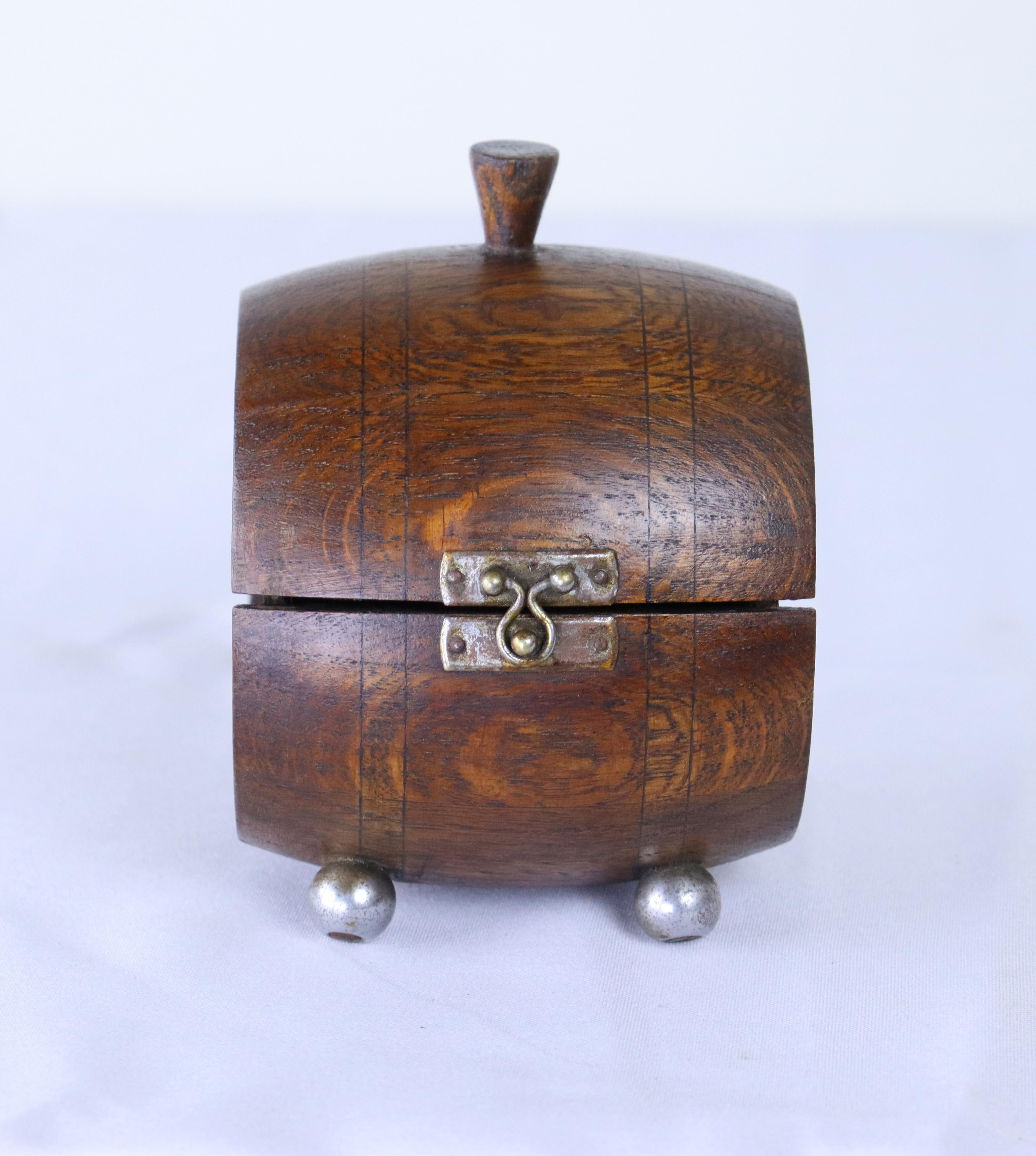 A sweet tea caddy or box, shapped like a cask.  Small bun feet add to the look.  The top does not close completely due to age and shrinkage.  As shown.  Priced accordingly.