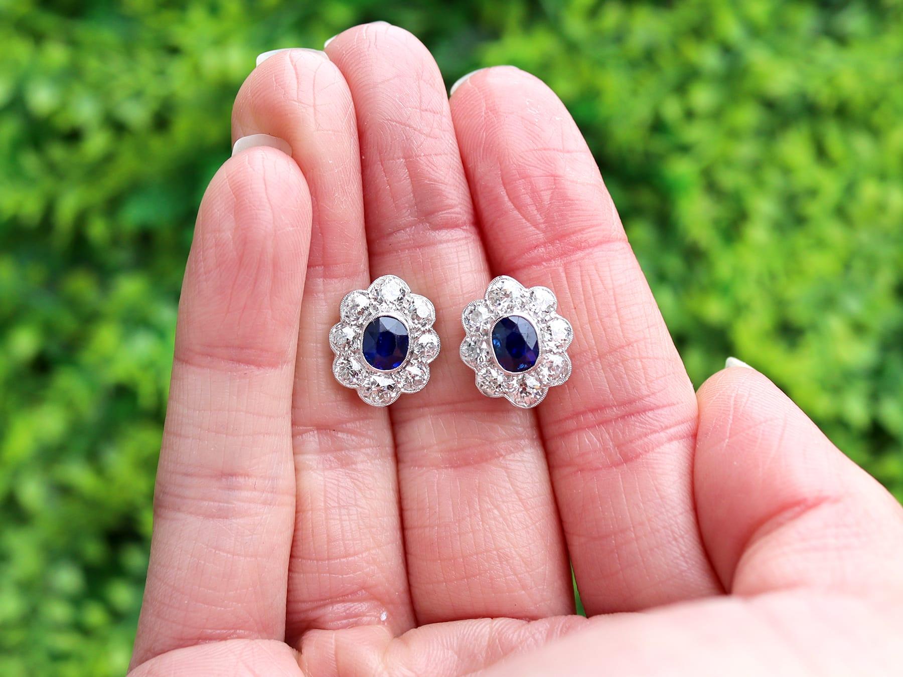 A stunning, fine and impressive pair of antique 1.30 carat untreated Basaltic sapphire and 2.10 carat diamond, 18 carat white gold and platinum set cluster earrings; part of our diverse gemstone jewellery collections. 

These stunning, fine and