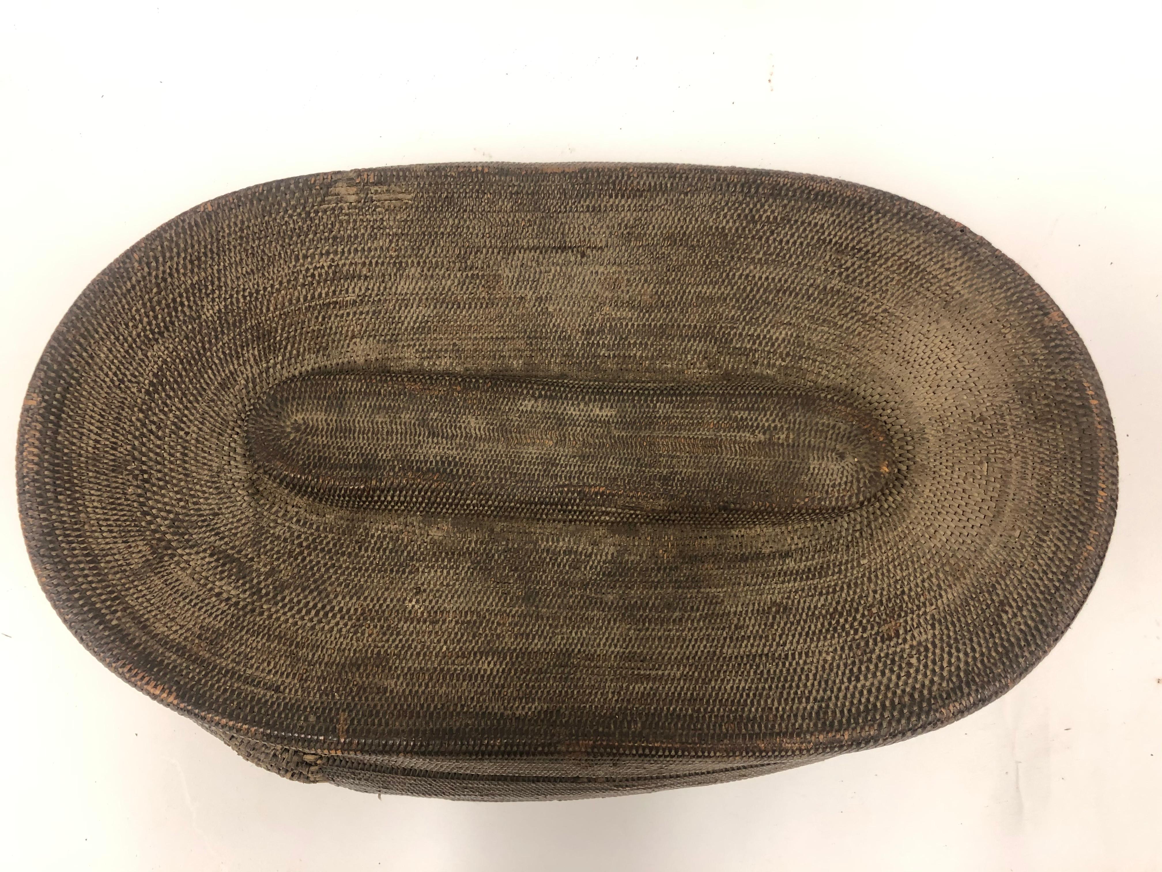 Antique oval basket with lid. Most likely from Africa.

Property from esteemed interior designer Juan Montoya. Juan Montoya is one of the most acclaimed and prolific interior designers in the world today. Juan Montoya was born and spent his early