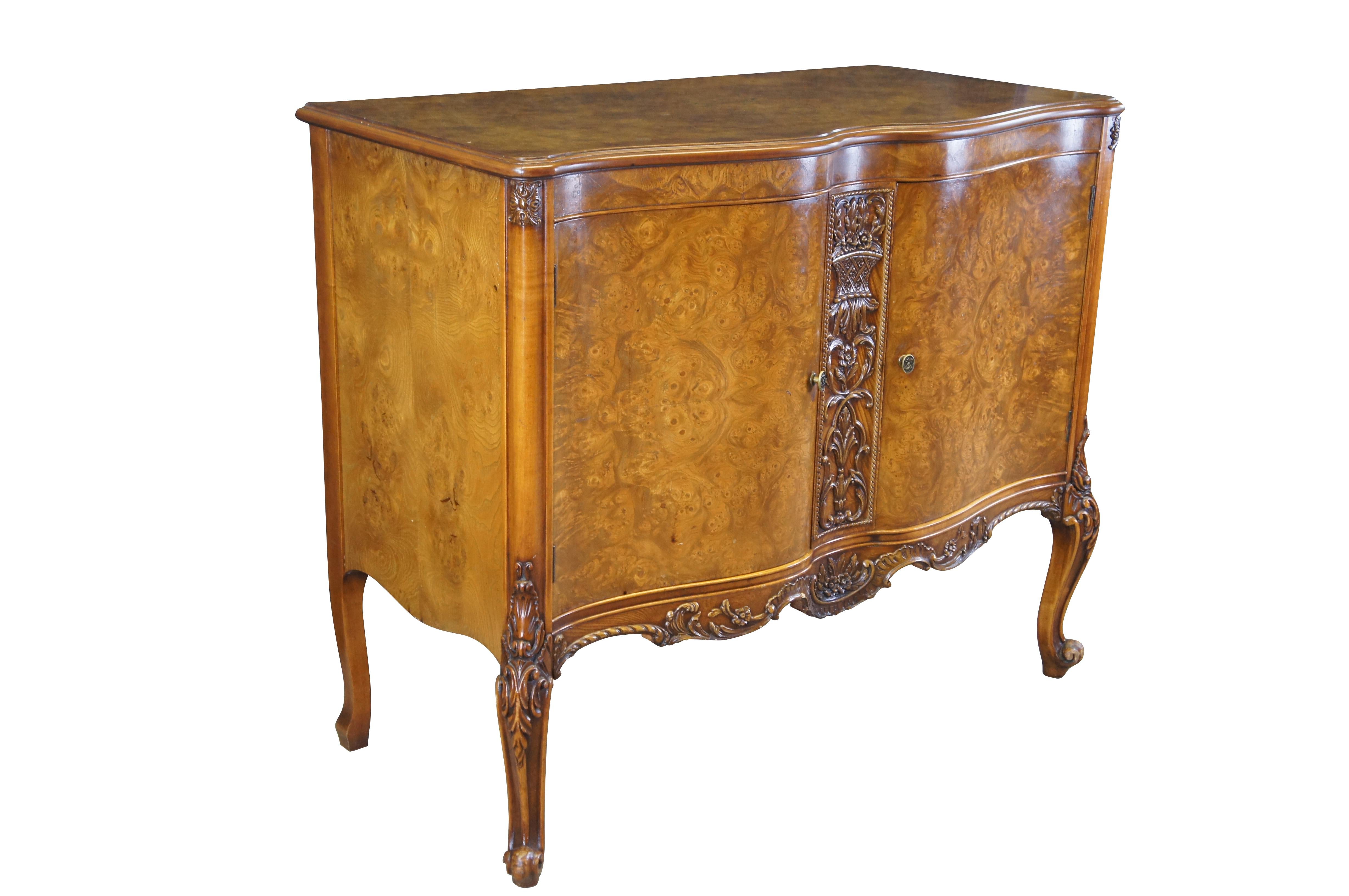 Antique Batesville French Provincial Louis XV Carpathian Elm cabinet / sideboard / buffet / credenza / console / commode / server.  Made of Carpathian cluster elm burl featuring serpentine form with floral and acanthus carvings, and cabriole legs.