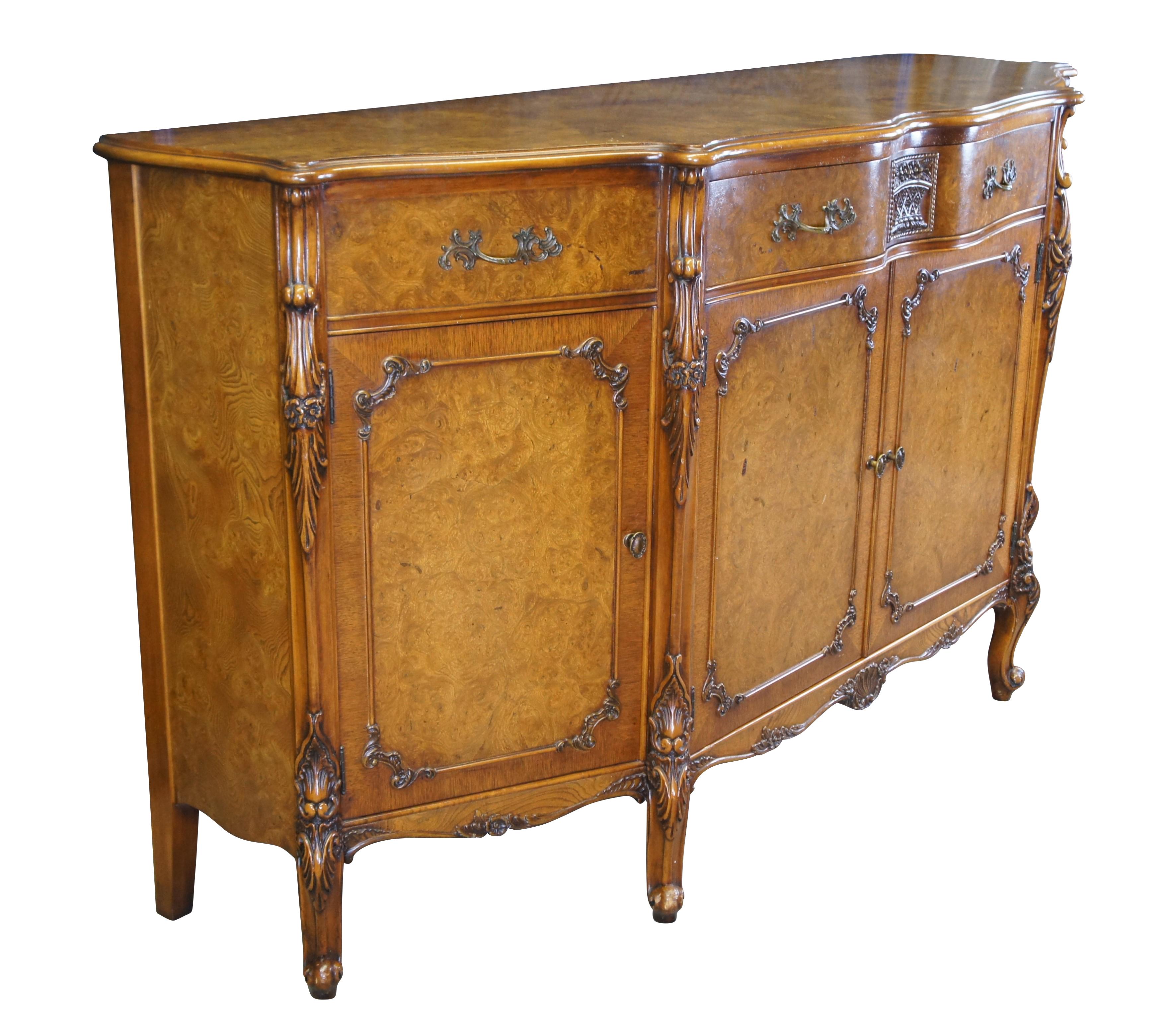 Batesville Romweber Industries French Provincial Louis XV Carpathian Elm sideboard / buffet / credenza / console or server.  Made of Carpathian cluster elm burl featuring serpentine form with large upper flatware drawer, flanked by two side drawers,