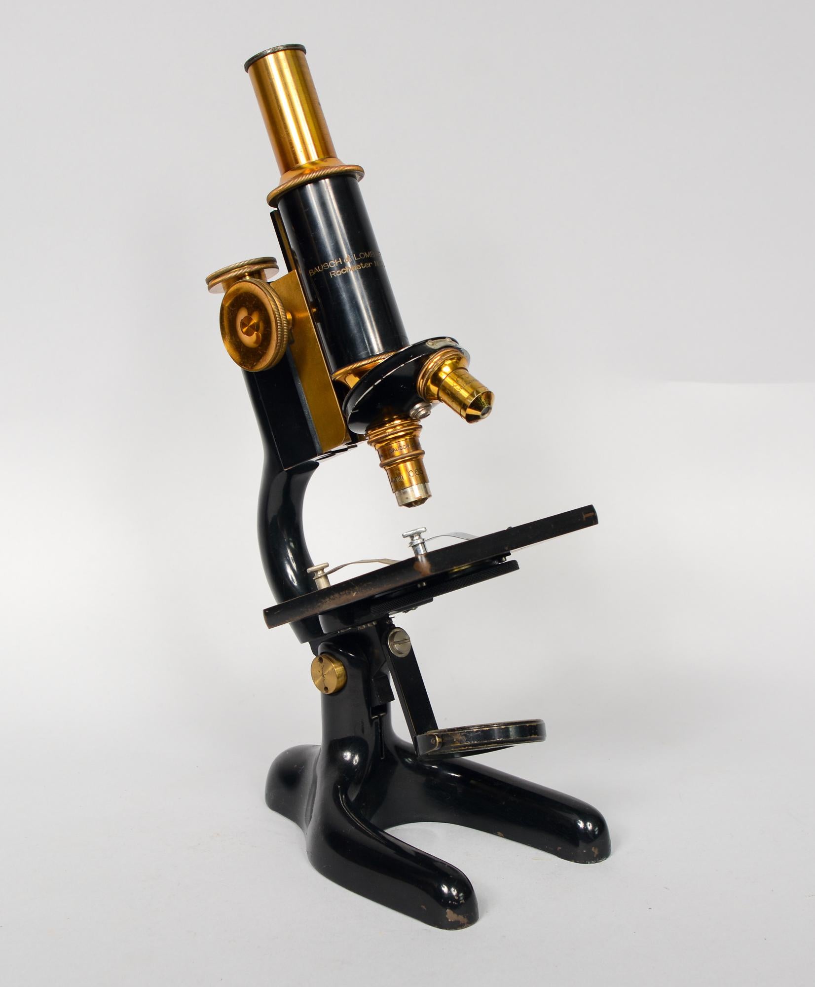Brass Bausch and Lomb microscope. This microscope has two objectives. The box this is in may not be the correct one. The dimensions listed are for the box. The microscope is 4.25 inches deep, 6.25 inches wide and 13 inches tall. This is from an