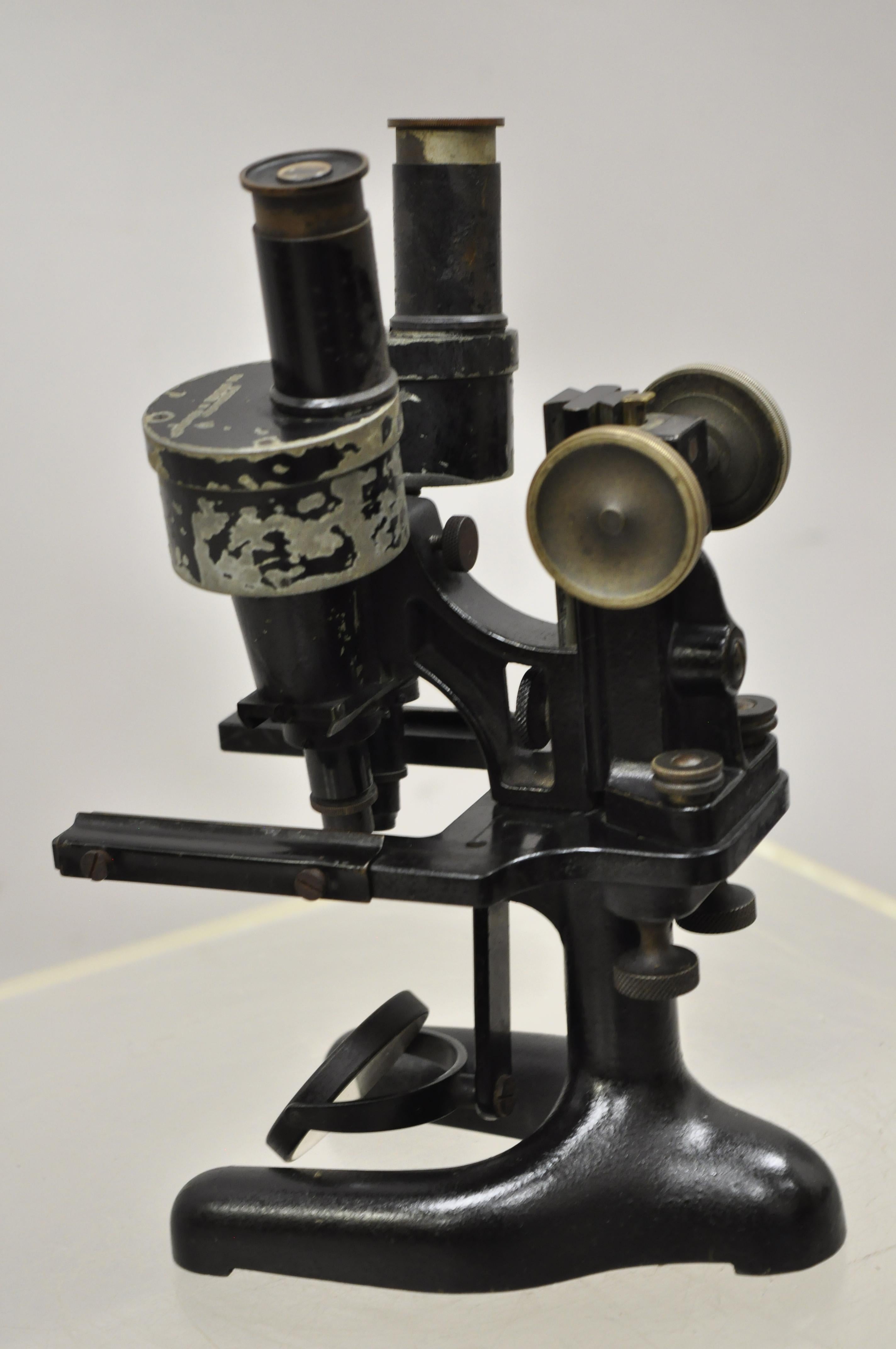 Antique Bausch-Lomb Arthur G. Thomas Microscope in case with extras. Item features original wood case, 2 extra viewers, 2 metal plates, metal handle, original stamp, no key, but unlocked, circa early 20th century. Measurements: Case: 13.75