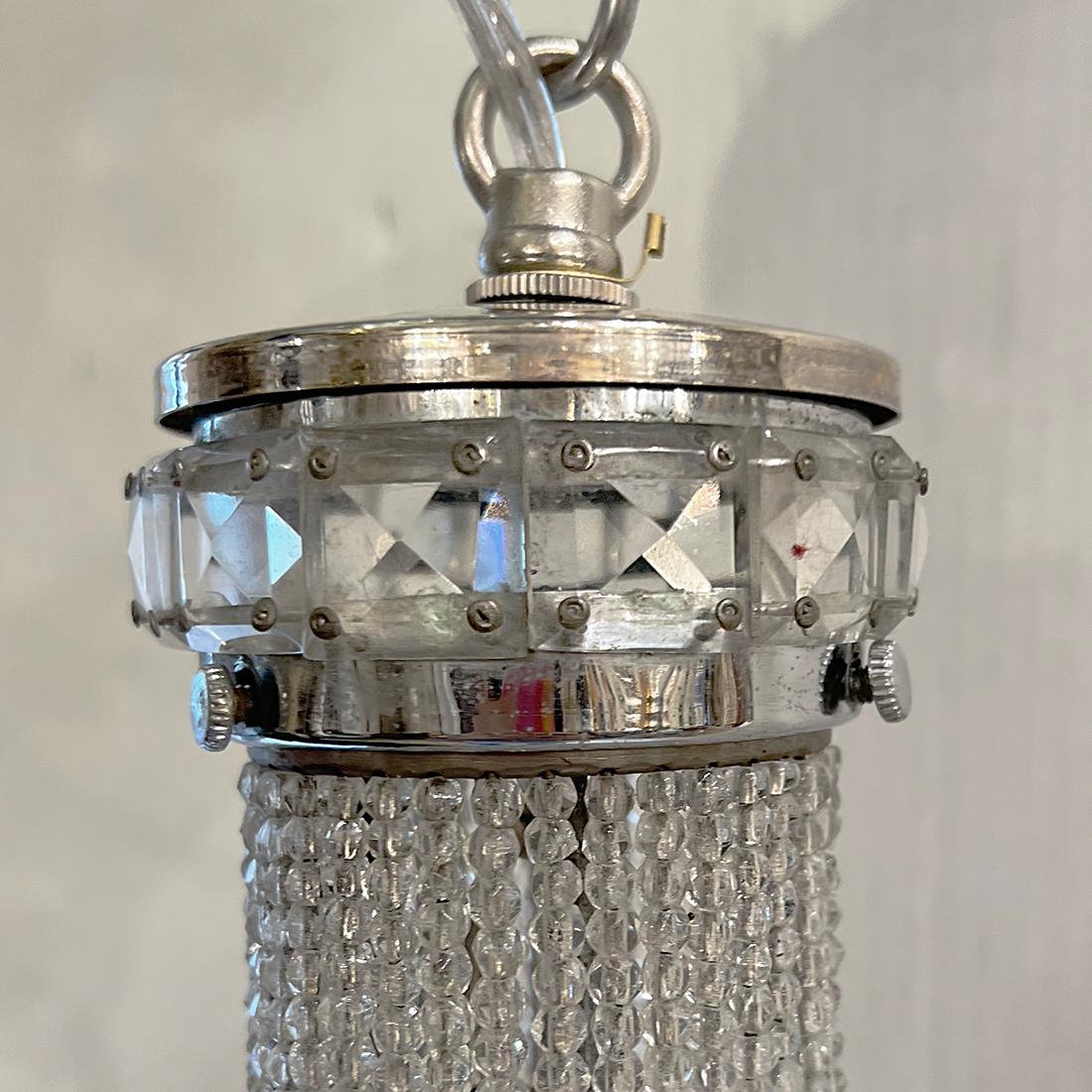 A circa 1920's French beaded crystals lantern with 2 interior lights.

Measurements:
Present Drop: 20.5
