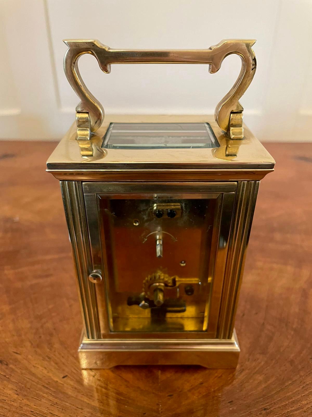 Antique brass carriage clock having a quality brass case, eight day french movement, enamelled dial with elegant original hands and bevel edged glass. It is in good working order and comes with the original key.

 An elegant example in lovely