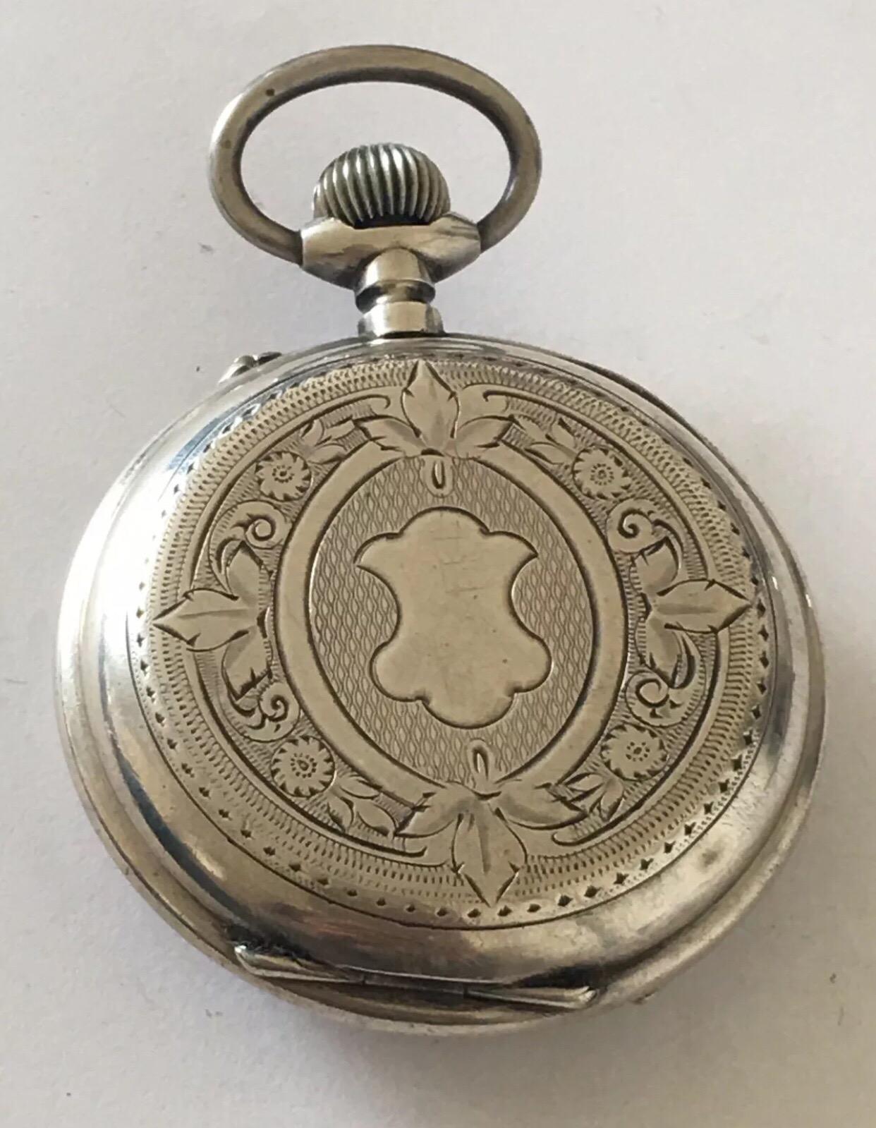 This Antique Beautifully Engraved Silver Case and hand painted enamel dial pocket watch is in good working condition and ticking well.