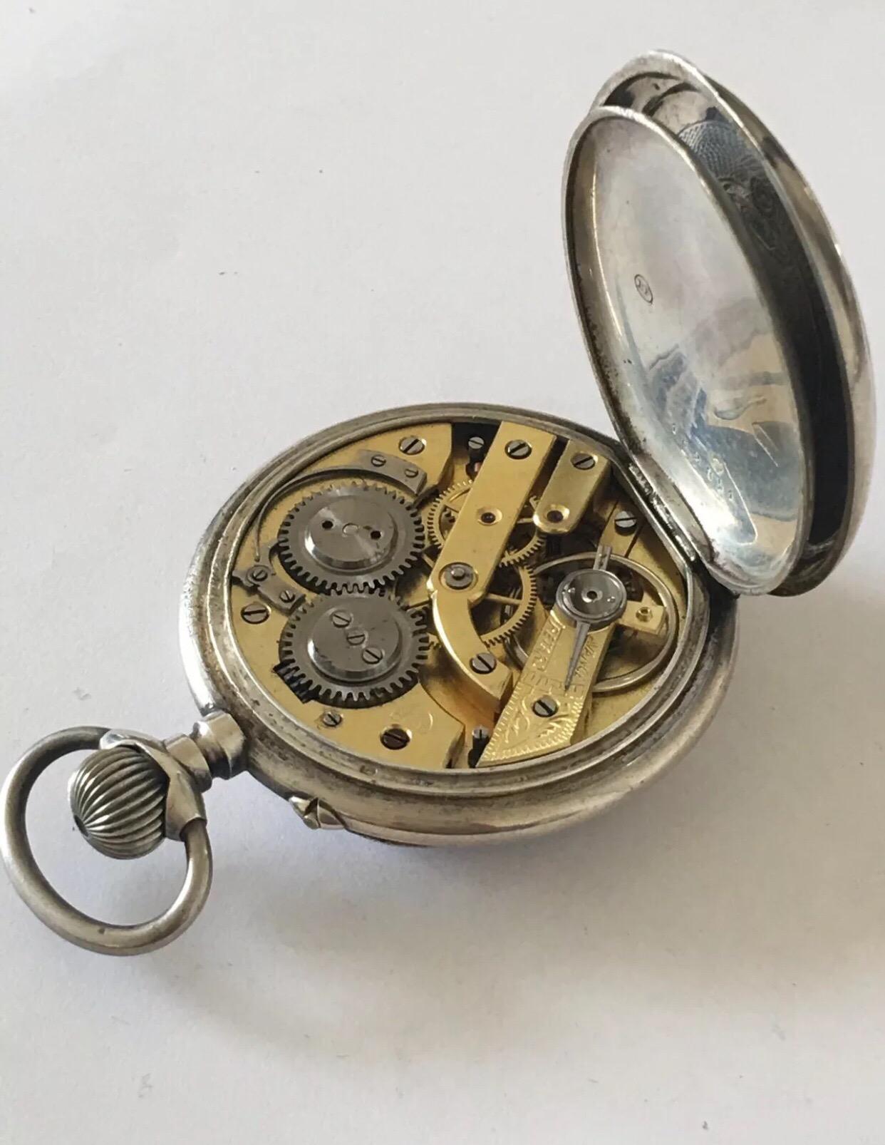 engraved silver pocket watch