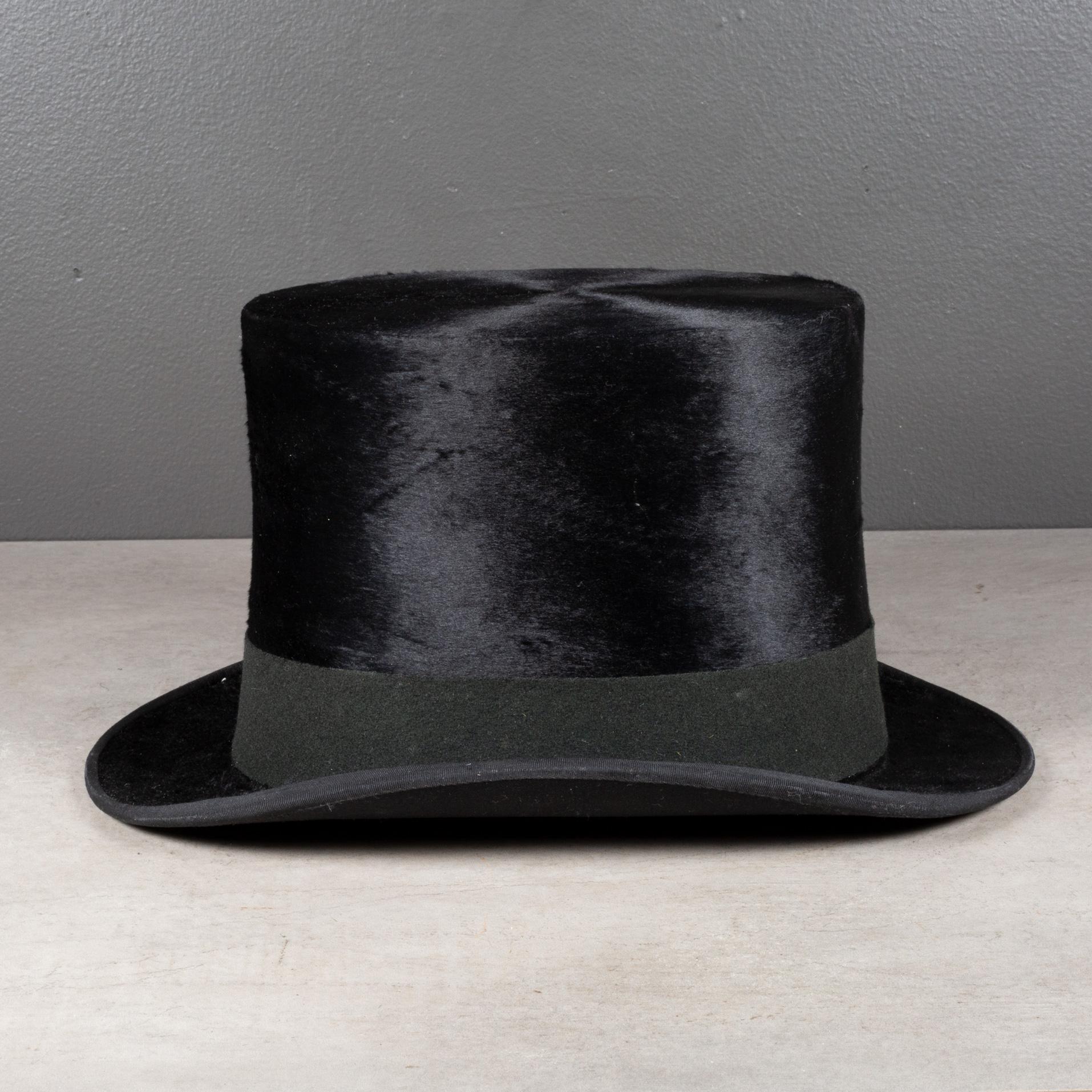 ABOUT

An antique black, Beaver skin top hat with brown leather interior band and fabric. Original label with monogram 