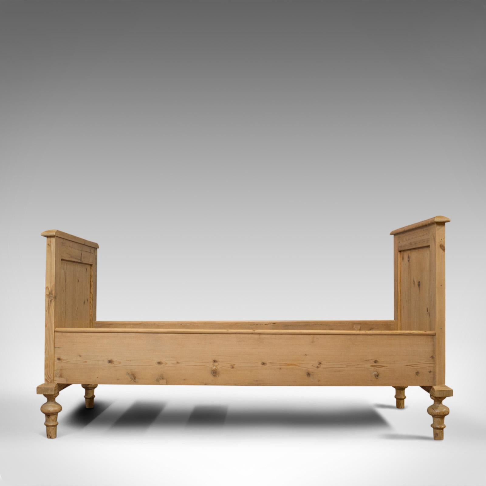 This is an antique bed frame. An English, Victorian pine bedstead dating to the late 19th century, circa 1900.

Select cuts of pine display rich biscuit hues and fine grain interest
Good consistent color throughout and a desirable aged