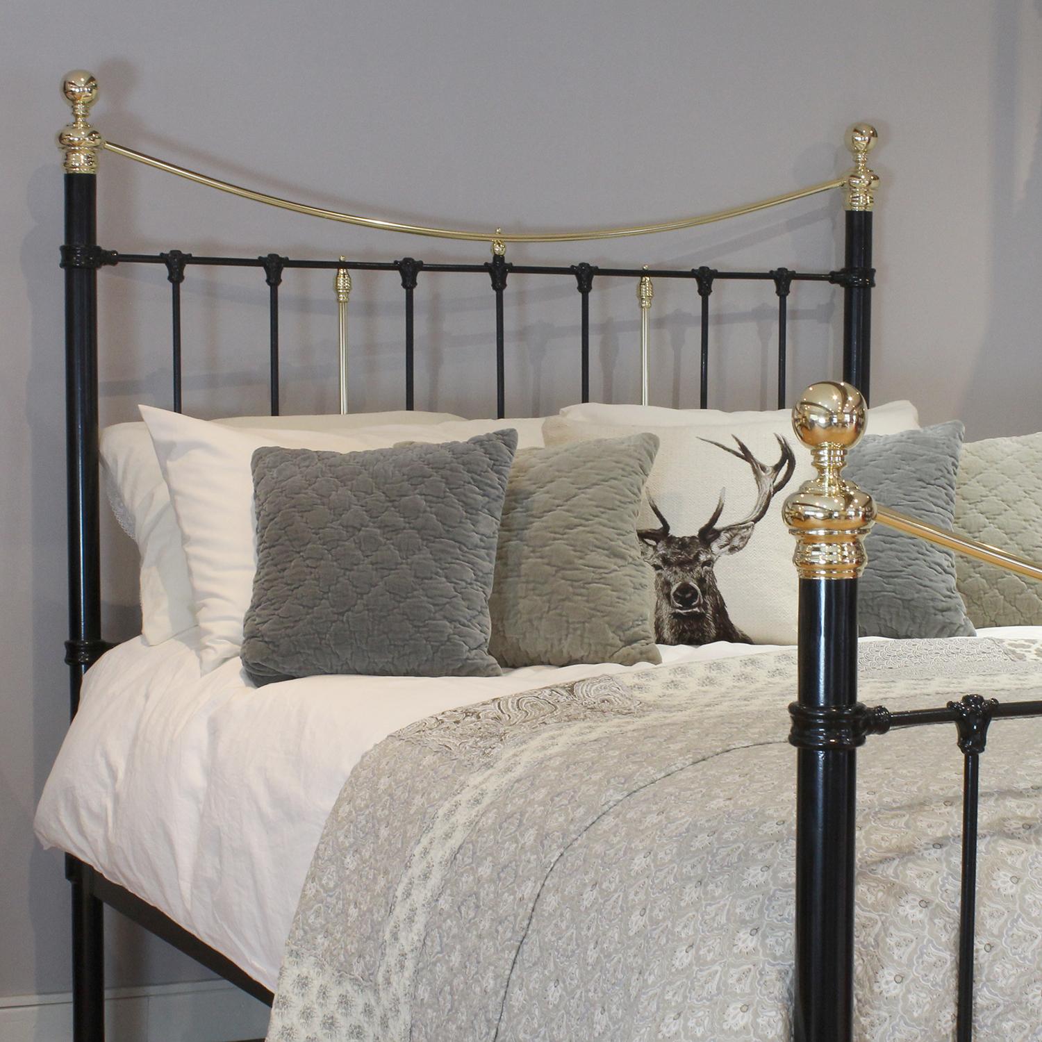 Cast iron and brass bedstead in black with substantial side posts, attractive cast iron mouldings and straight brass top rails. 

This bed accepts a UK king size or US queen size (5ft, 60in or 150cm wide) base and mattress set.

The price