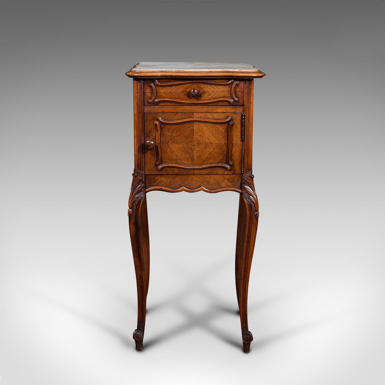This is an antique bedside cabinet. A French, walnut and marble night stand, dating to the Victorian period, circa 1900.

Beautifully presented with appealing, tactile top
Displays a desirable aged patina throughout
Select walnut presents rich