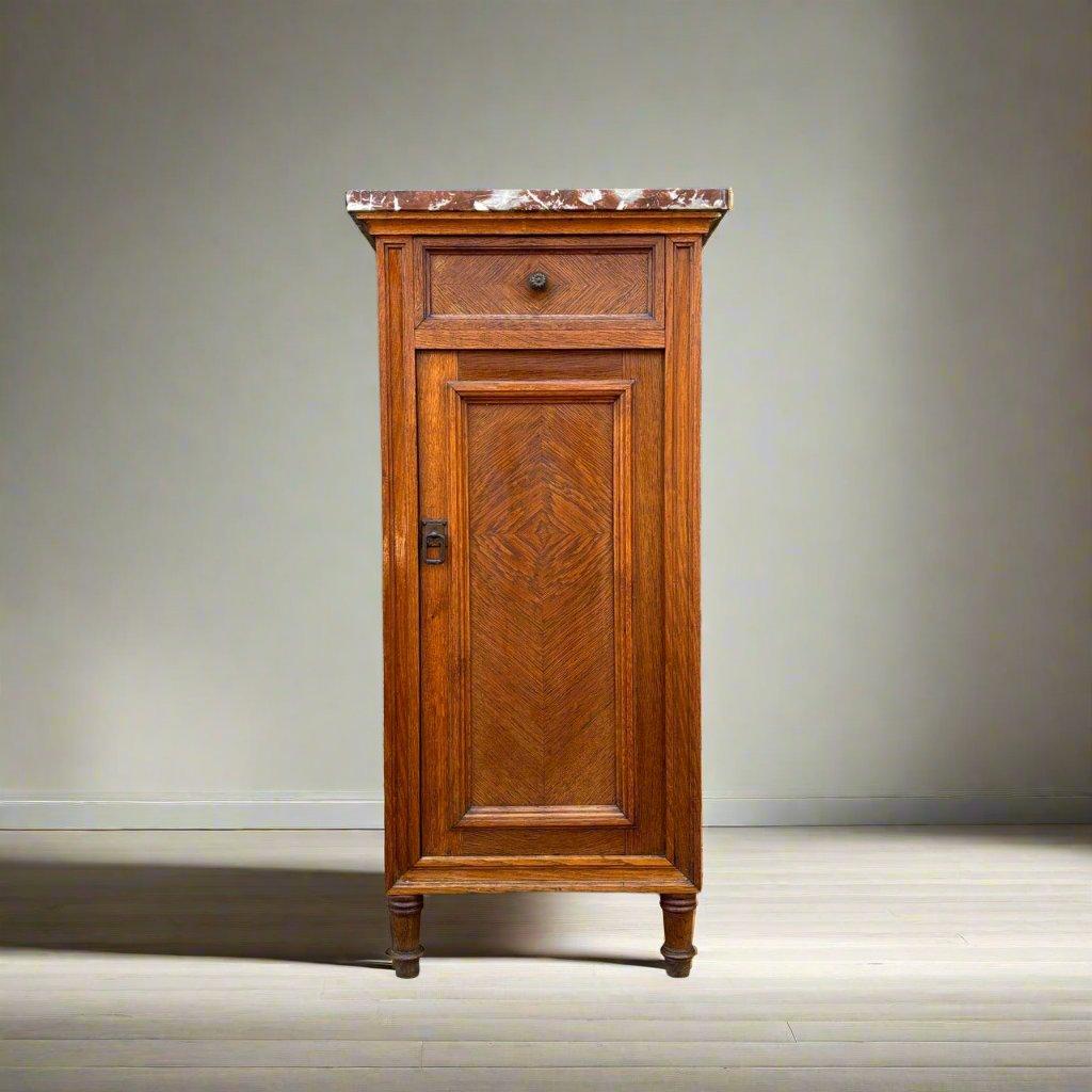 ✓ High-quality materials
✓ Solid construction
✓ Classic design

Dimensions: W: 40cm H: 85.5cm D: 36cm

Article: Antique bedside table  side table
Item no.: 1004
Epoch: Art Nouveau around 1910
Material: Oak & marble
Color: Brown
Condition: In very
