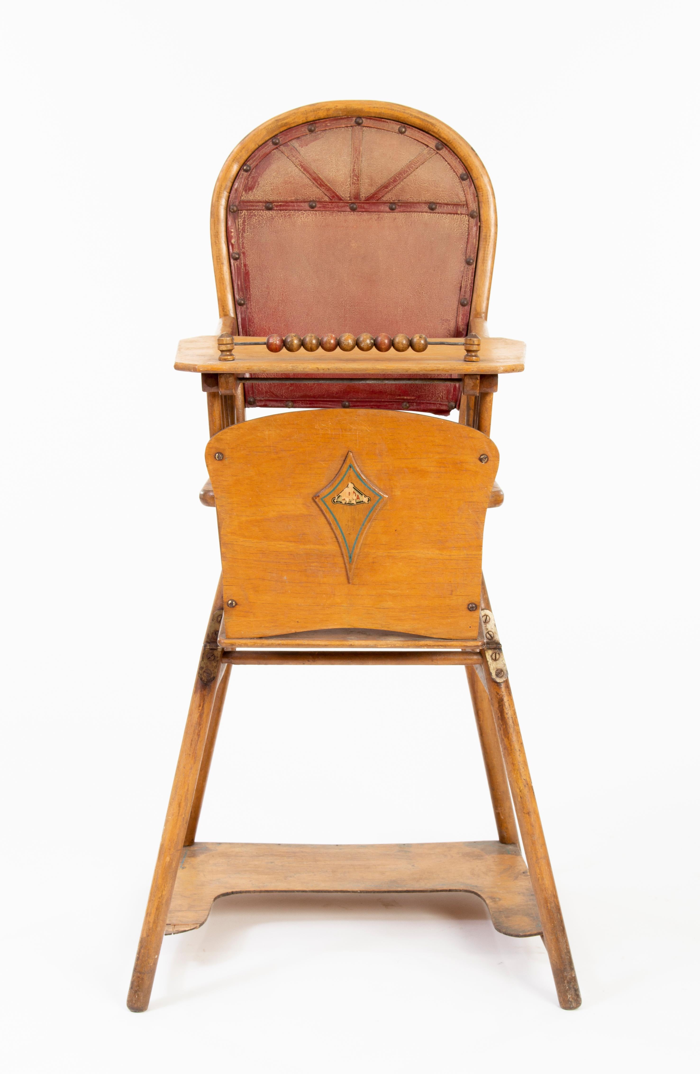 Antique children's highchair with an abacus and potty chair functions.
Made of steamed beechwood, with leather cover.
Manufactured around 1910.
 