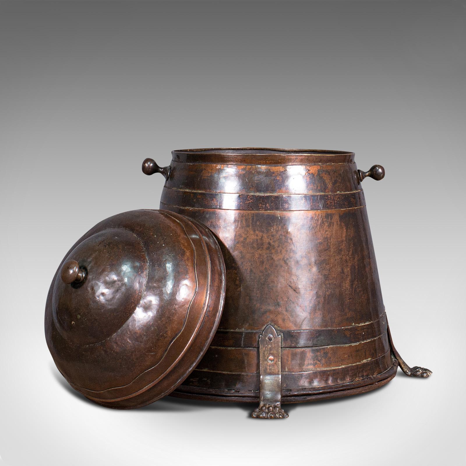 This is an antique beehive fireside store. An English, copper fire bucket or coal bin, dating to the early Victorian period, circa 1850.

Fascinating tapered form and colouration
Displays a desirable aged patina
Pleasingly tarnished copper with