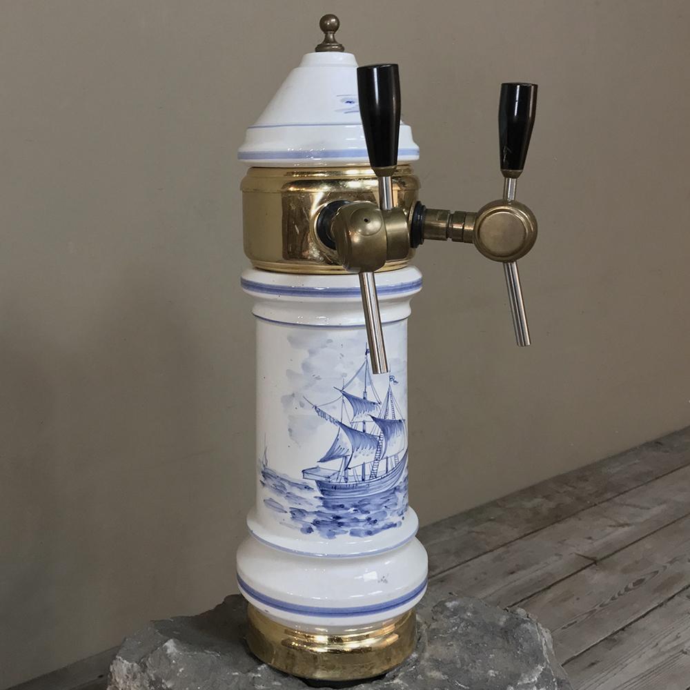 Antique Belgian beer tap is the perfect finishing touch to your home bar! Hand-painted with nautical scenes, it features a blue and white main body mounted with brass fittings and polished wood handles. What a great addition to your bar!
circa