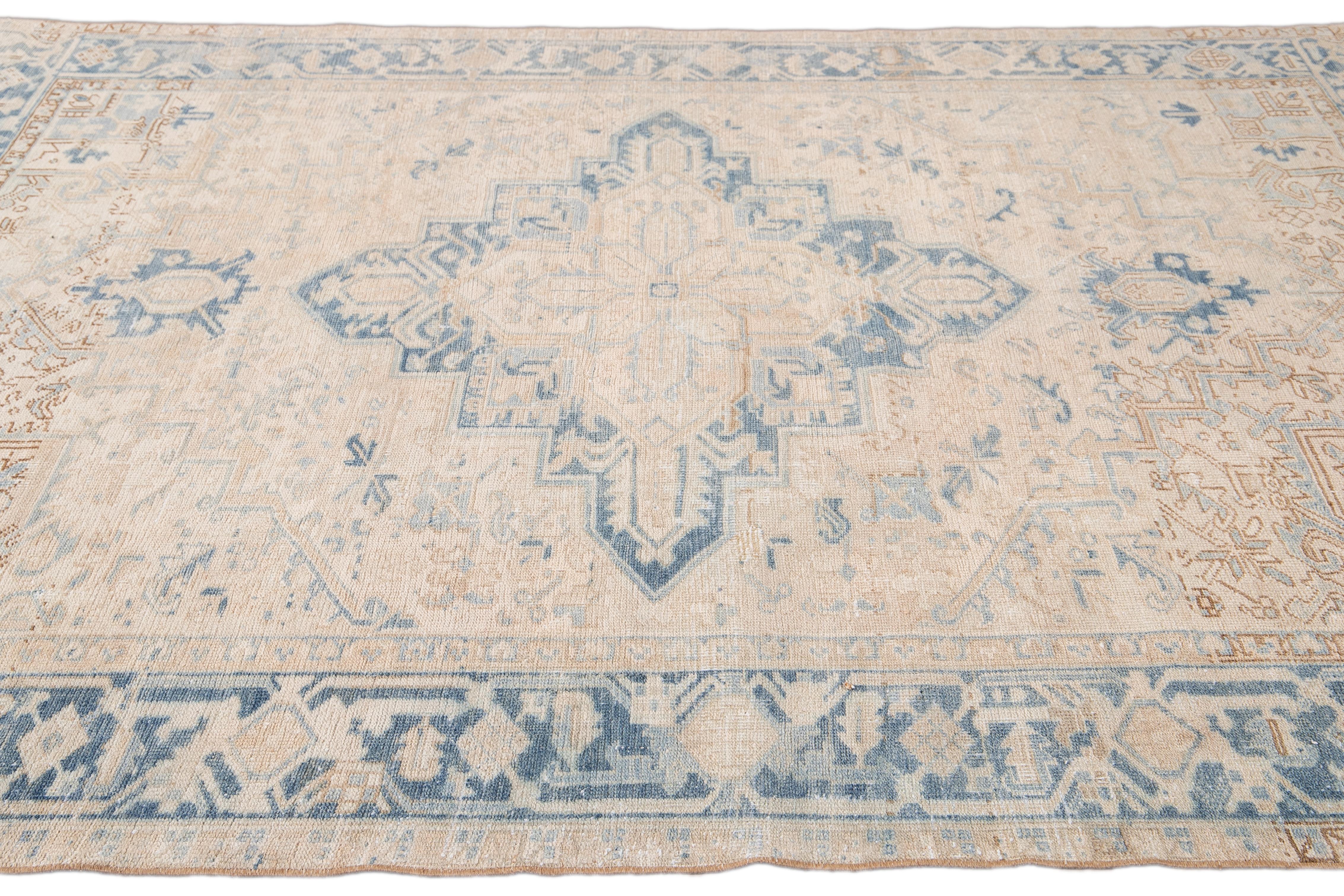 Early 20th Century Antique Beige and Blue Persian Heriz Handmade Medallion Floral Wool Rug For Sale