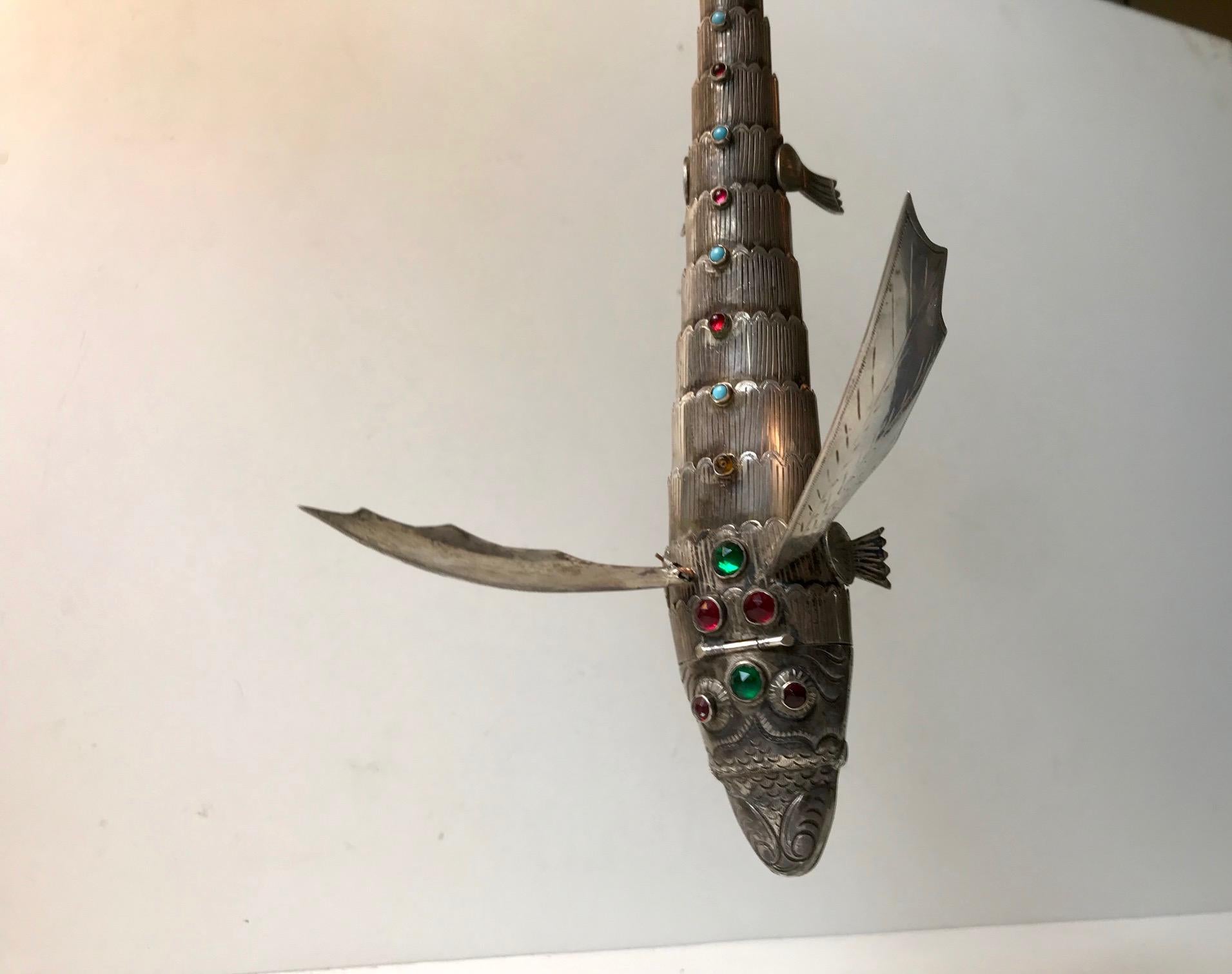 Large articulated Dragon detailed with hand engraved patterns, faceted glass beats and semi precious stones. The head is hinged to open as a secret box originally intended for storing opium or valuable spices. It is fully hallmarked and tested as