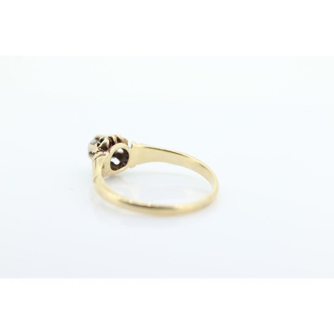 Vintage from the 1910s
Size: 7 1/2 US
Materials: Stone
Gemstone: Diamond
Gem Color: Colorless
Band Color: Gold

Adjustable

This one is an incredible find. Early 20th century 14k Yellow gold with a round diamond belcher set. High rise