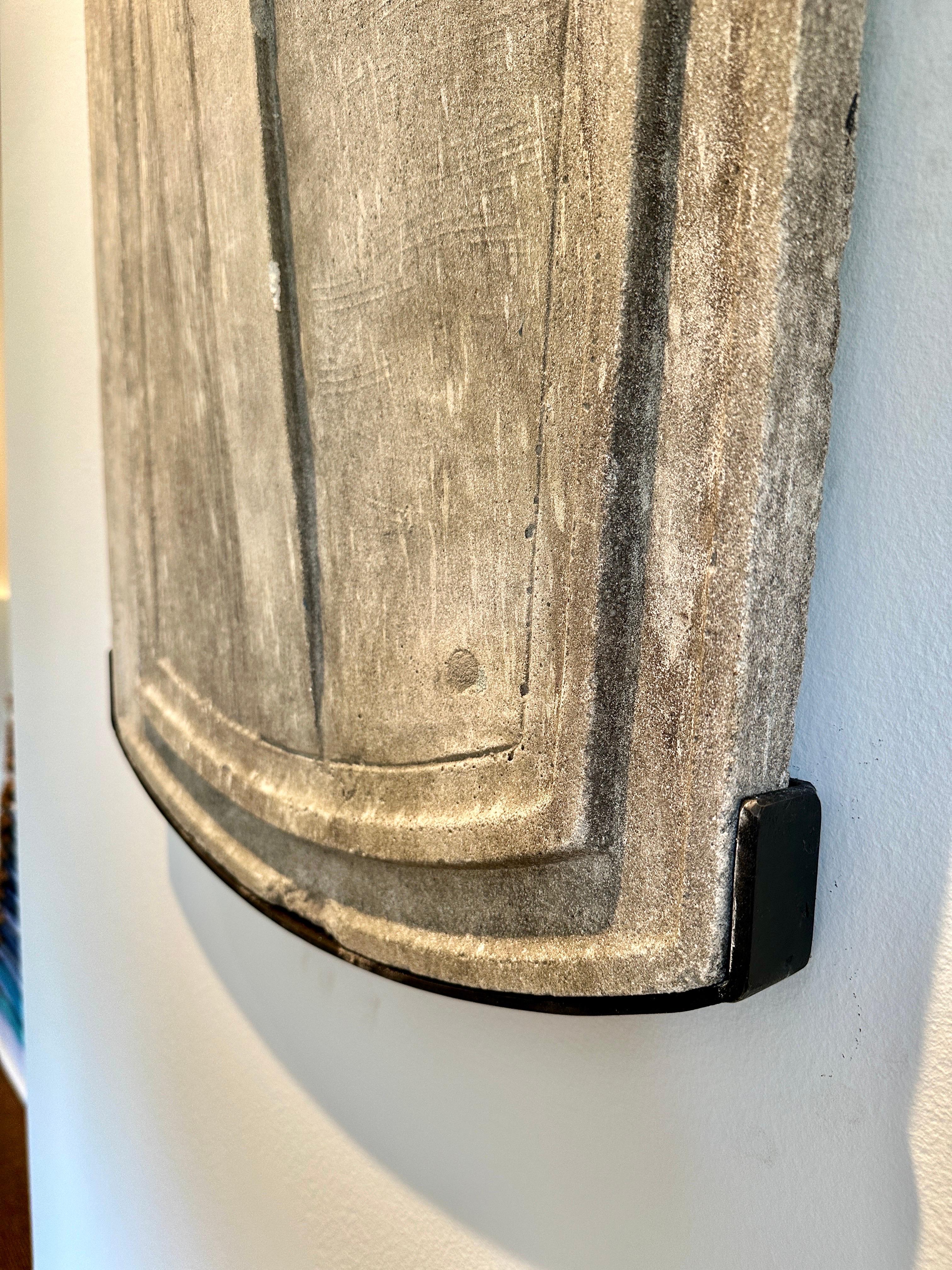 This is a wonderful antique architectural element mounted to custom iron wall bracket for best display and viewing.  THIS ITEM IS LOCATED AND WILL SHIP FROM OUR EAST HAMPTON, NY SHOWROOM.